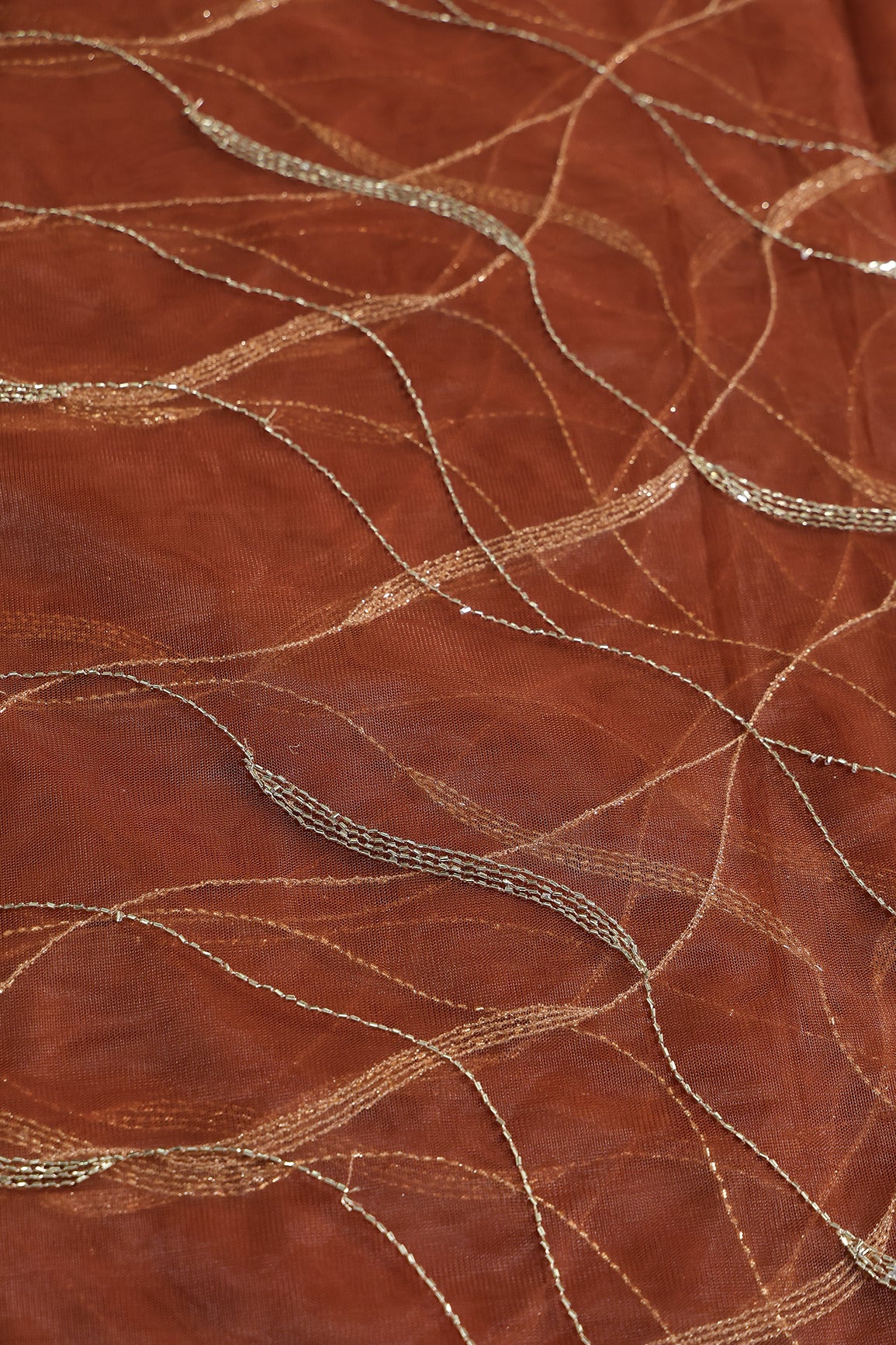 Leheriya Embroidery Work With Sequins And Beads On Rust Soft Net Fabric