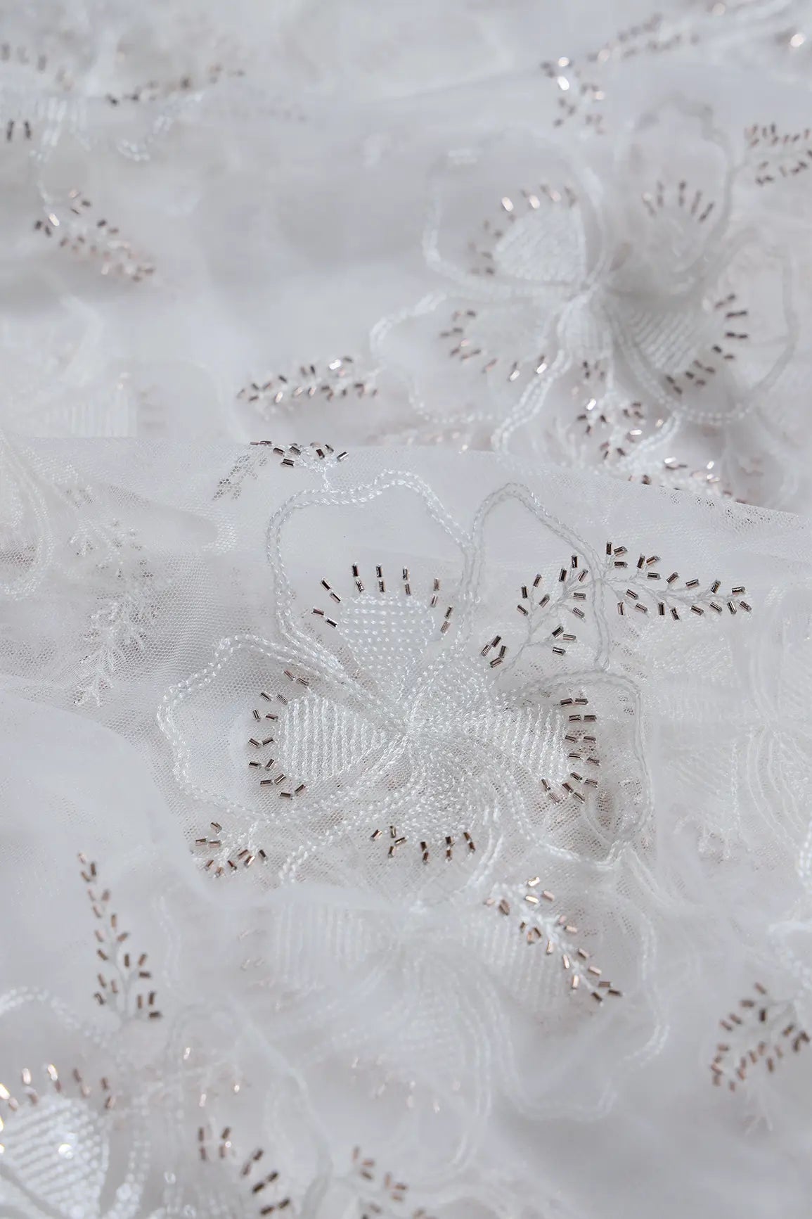 White Thread & Gold Beads With Water Sequins Floral Embroidery On Dyeable White Soft Net Fabric