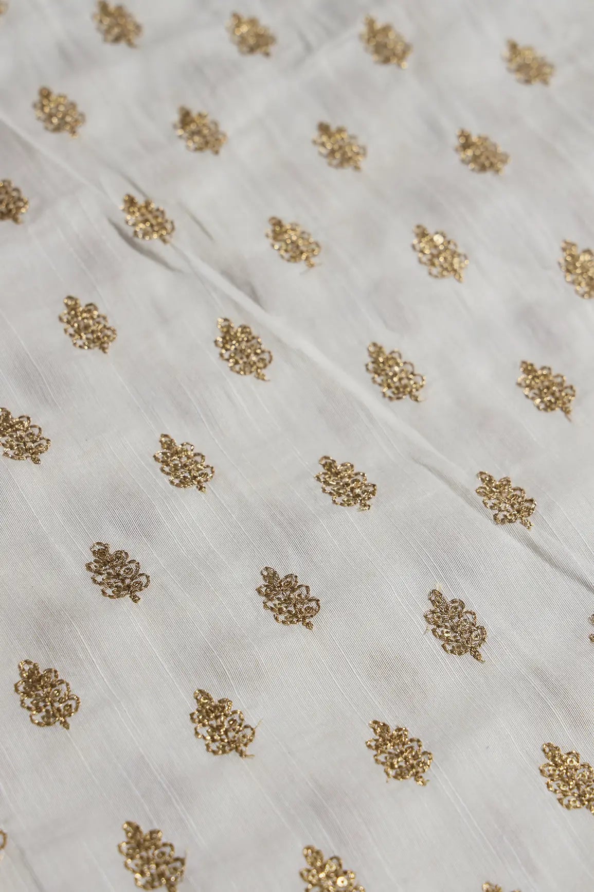 Gold Sequins With Gold Zari Small Motif Embroidery Work On White Raw Silk Fabric