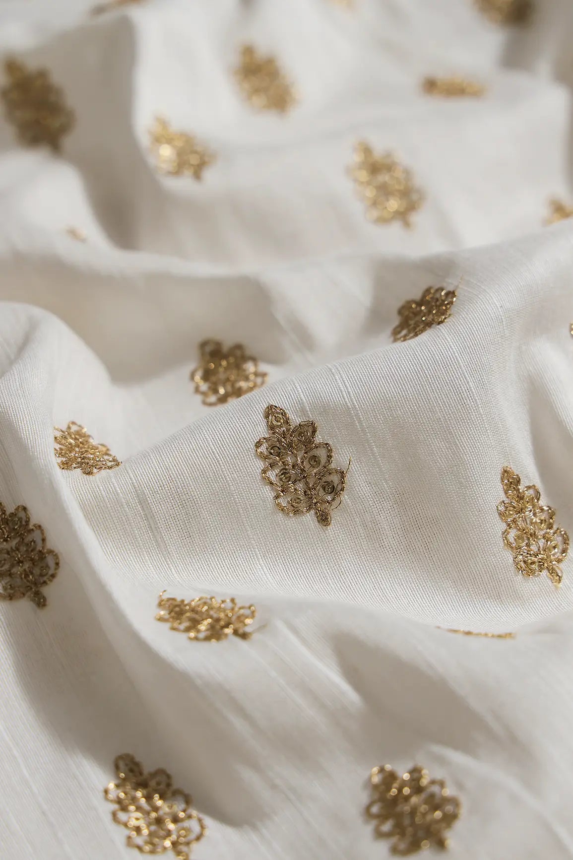 Gold Sequins With Gold Zari Small Motif Embroidery Work On White Raw Silk Fabric