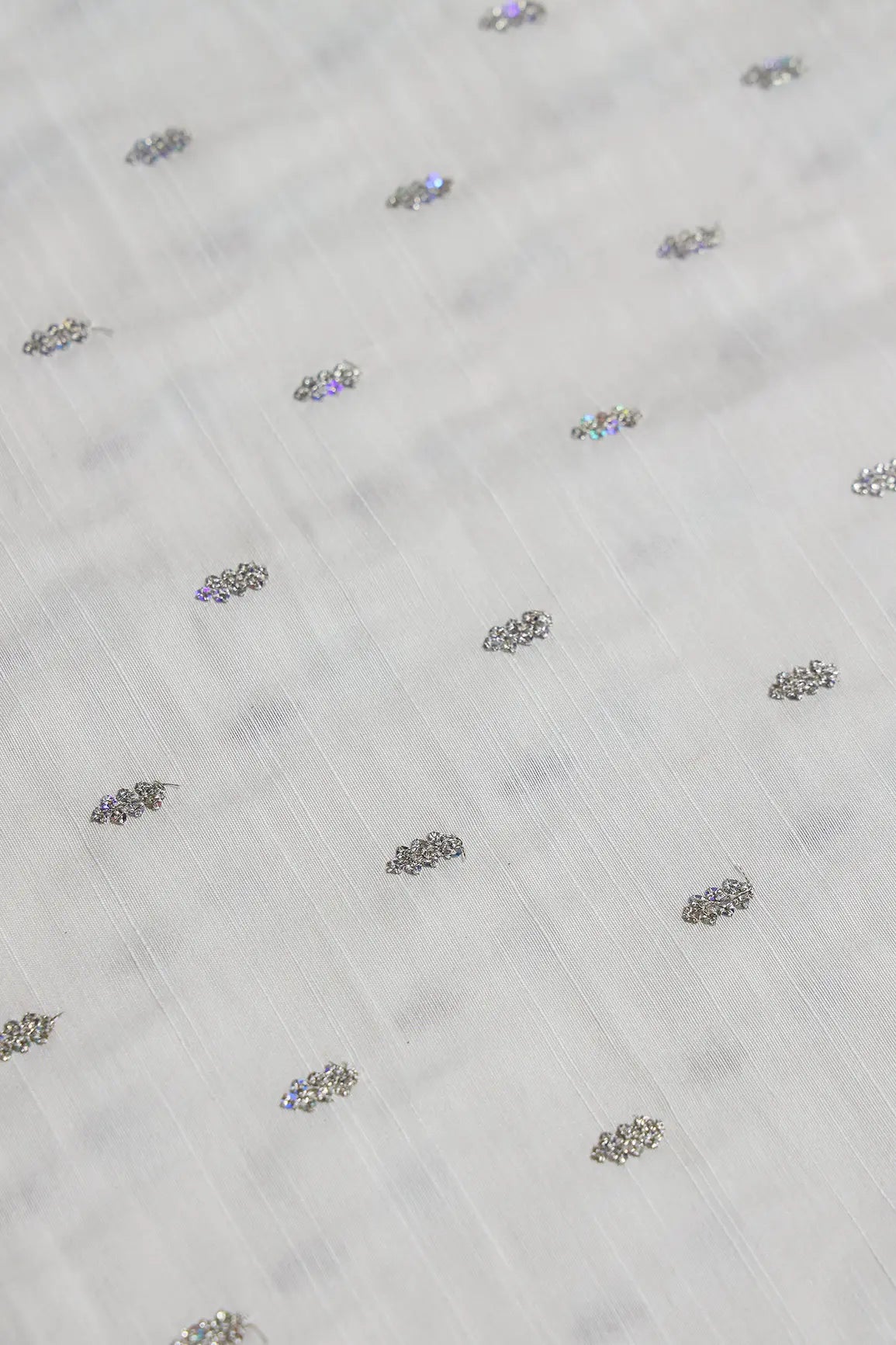 Silver Sequins With Gold Zari Small Motif Embroidery Work On White Raw Silk Fabric