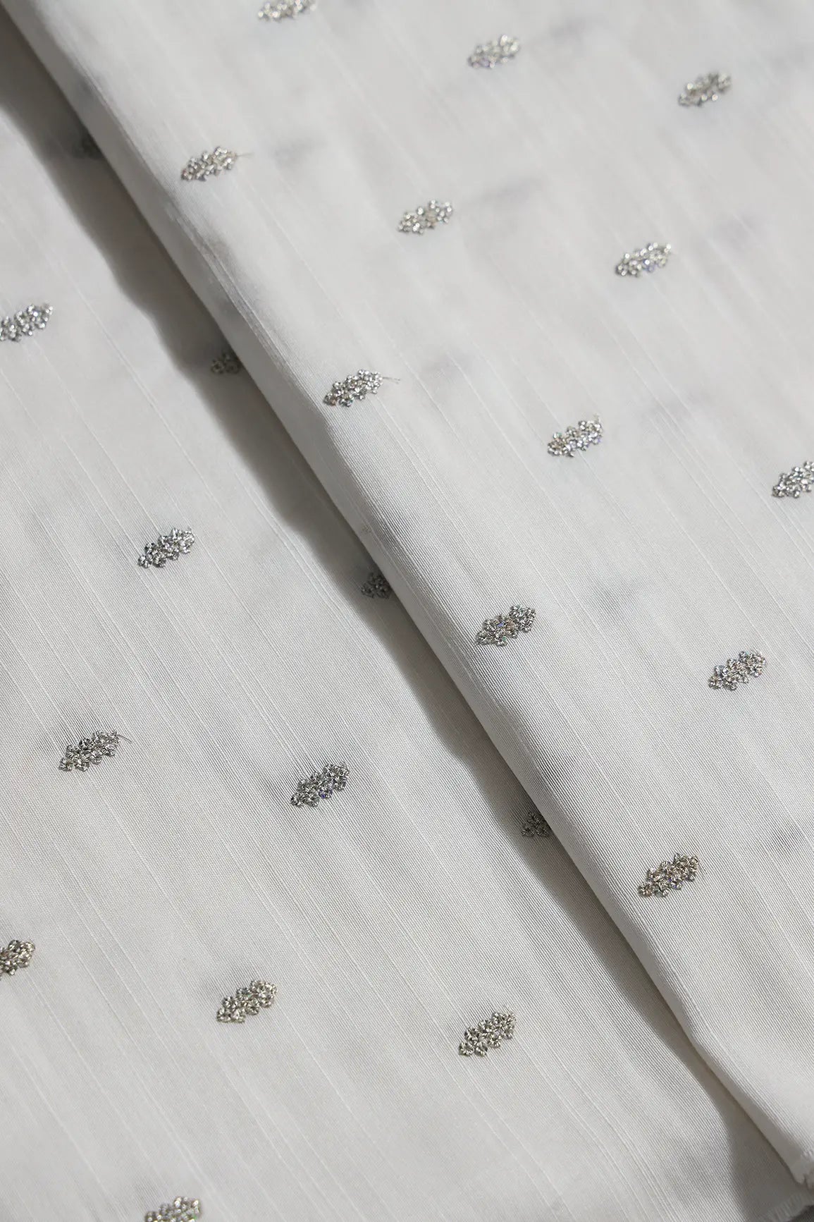 Silver Sequins With Gold Zari Small Motif Embroidery Work On White Raw Silk Fabric