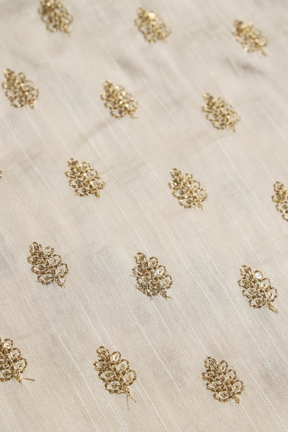 Gold Sequins With Gold Zari Small Motif Embroidery Work On Cream Raw Silk Fabric
