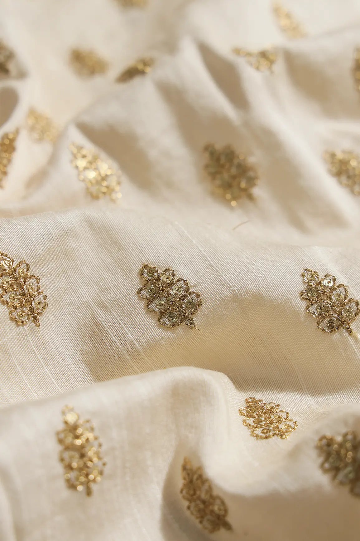 Gold Sequins With Gold Zari Small Motif Embroidery Work On Cream Raw Silk Fabric