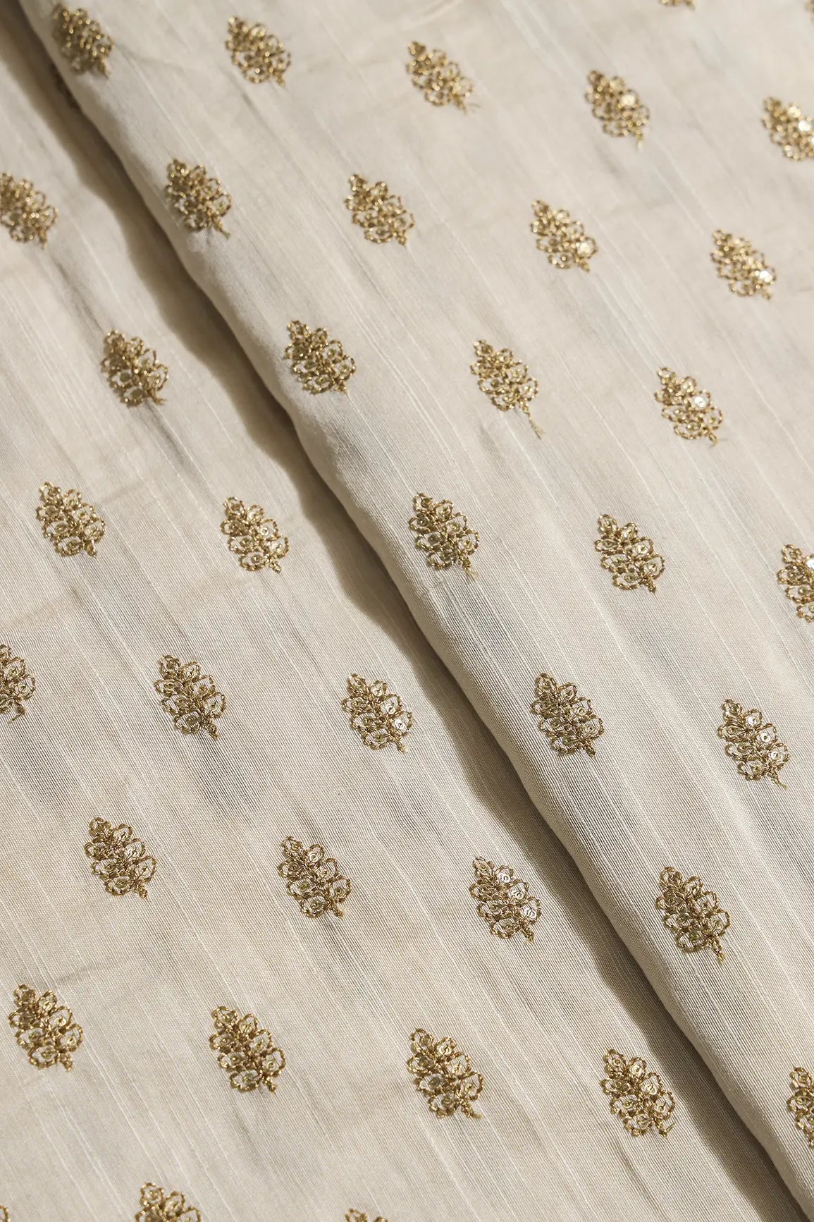 Gold Sequins With Gold Zari Small Motif Embroidery Work On Cream Raw Silk Fabric