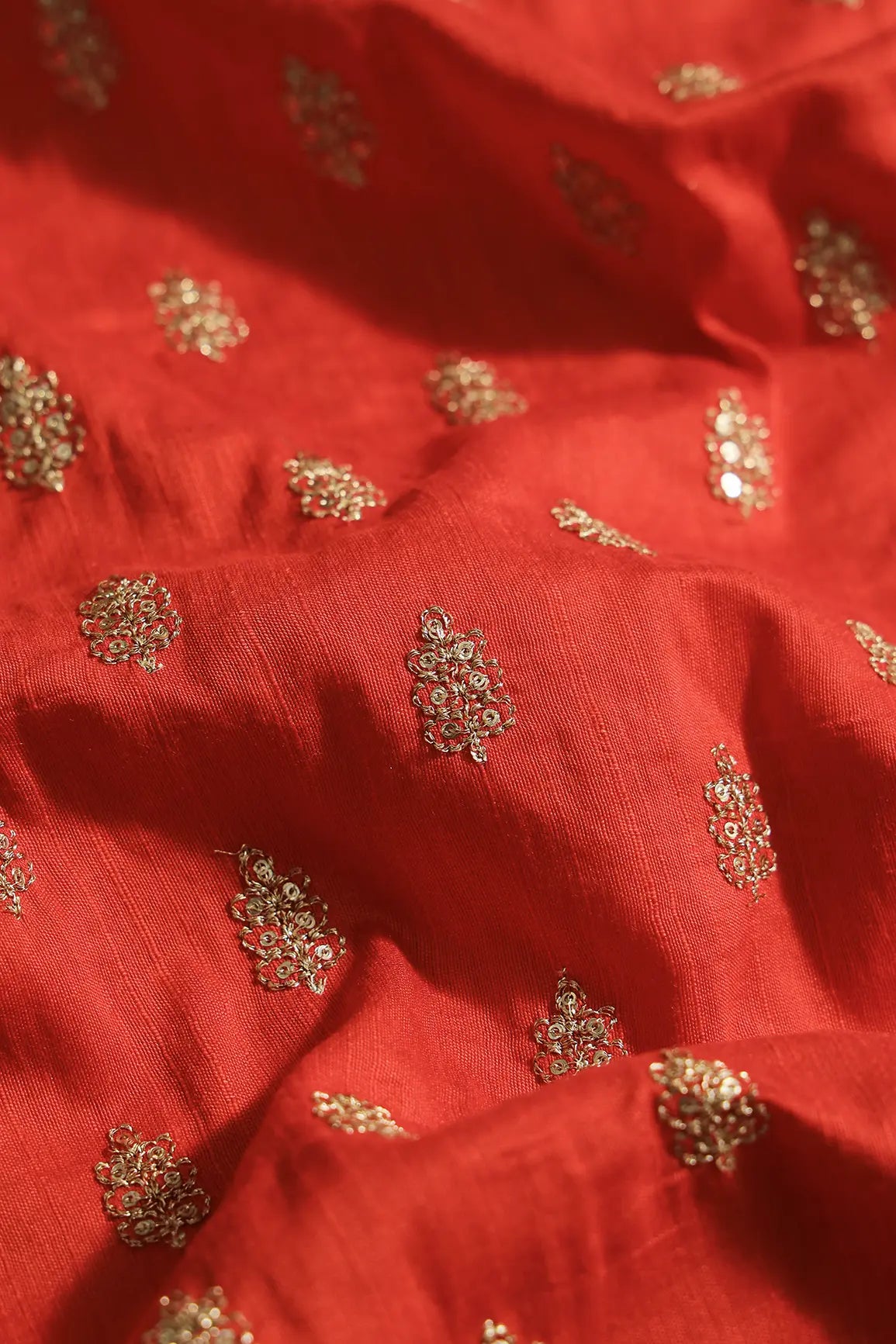 Gold Sequins With Gold Zari Small Motif Embroidery Work On Orange Raw Silk Fabric