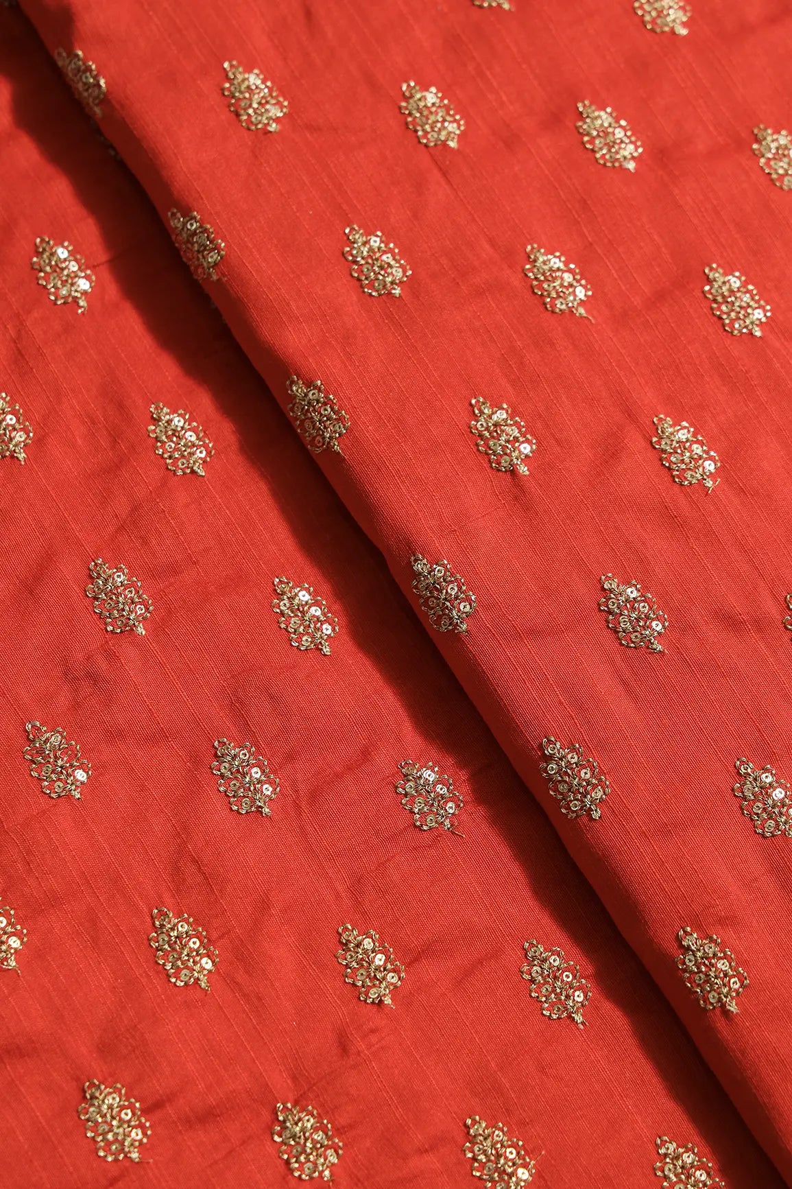 Gold Sequins With Gold Zari Small Motif Embroidery Work On Orange Raw Silk Fabric