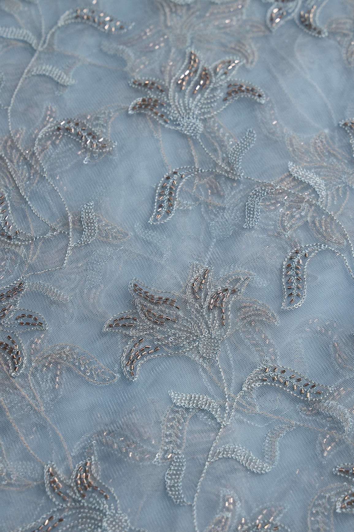 Light Blue Thread & Beads With Water Sequins Floral Leafy Embroidery Work On Light Blue Soft Net Fabric