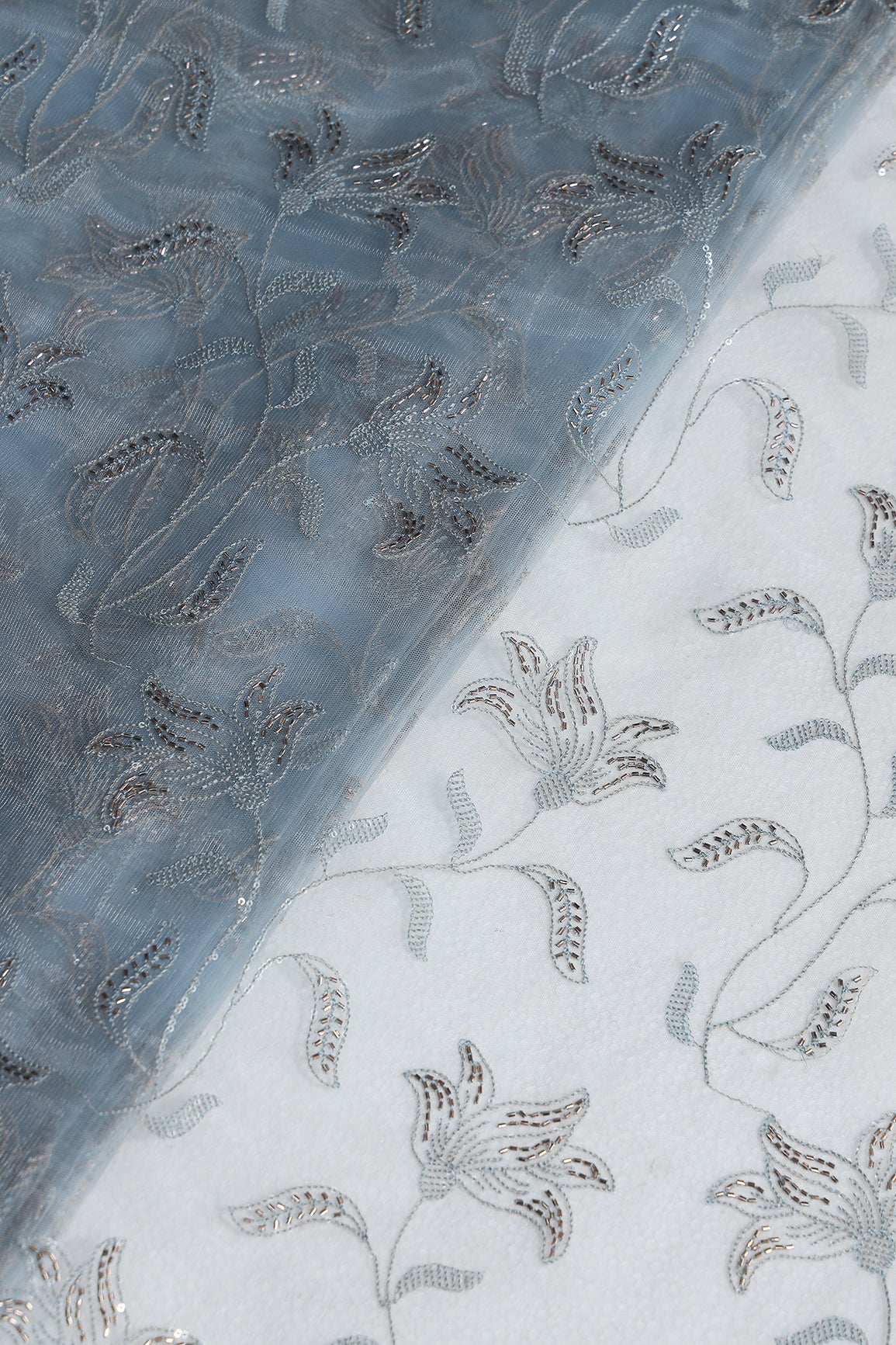 Light Blue Thread & Beads With Water Sequins Floral Leafy Embroidery Work On Light Blue Soft Net Fabric