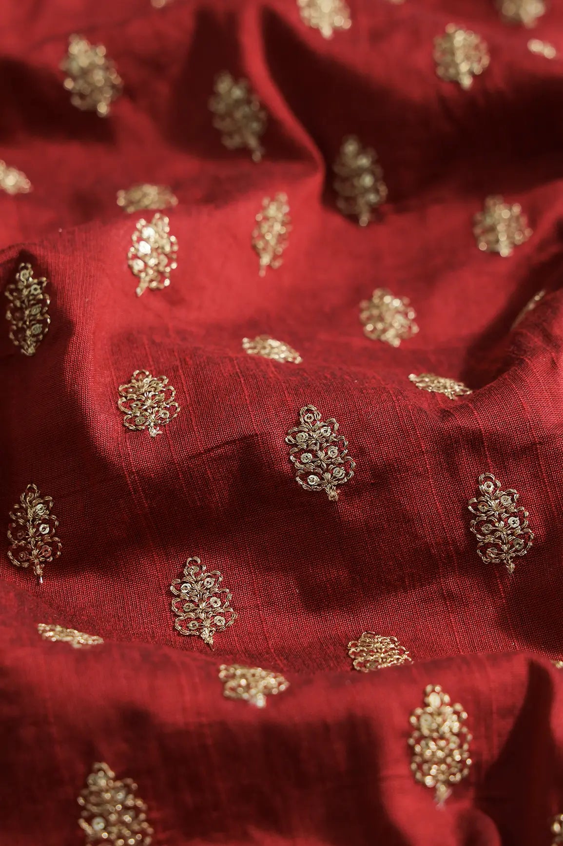 Gold Sequins With Gold Zari Small Motif Embroidery Work On Maroon Raw Silk Fabric