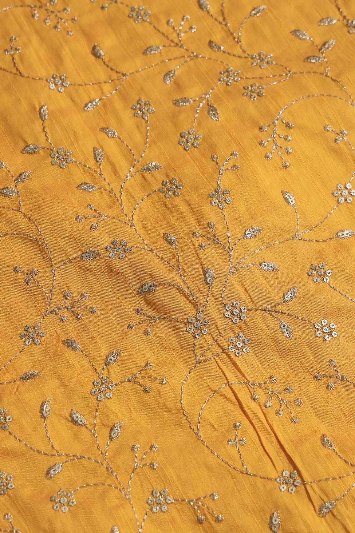 Gold Sequins With Gold Zari Floral Leafy Embroidery Work On Yellow Raw Silk Fabric
