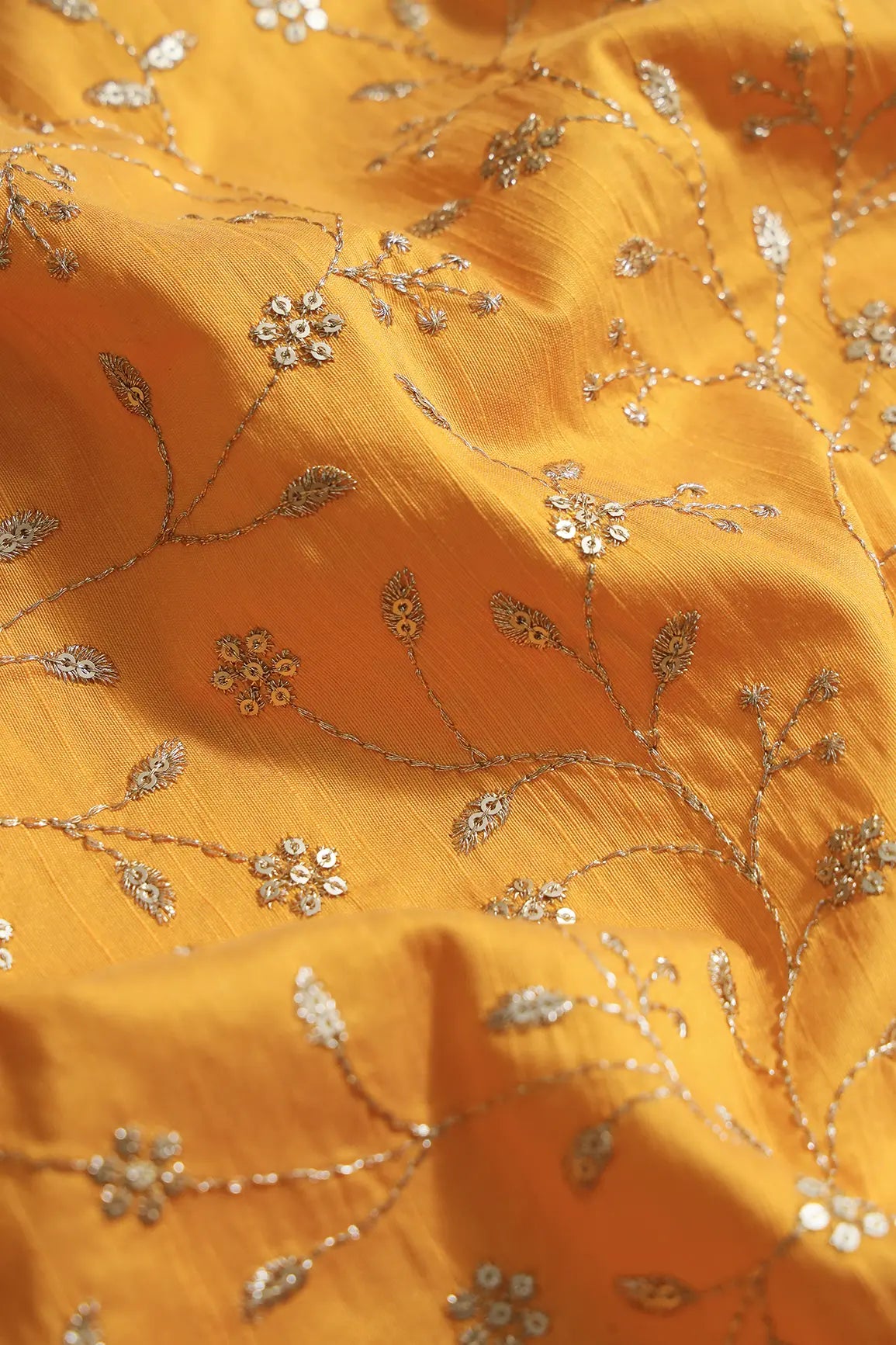 Gold Sequins With Gold Zari Floral Leafy Embroidery Work On Yellow Raw Silk Fabric