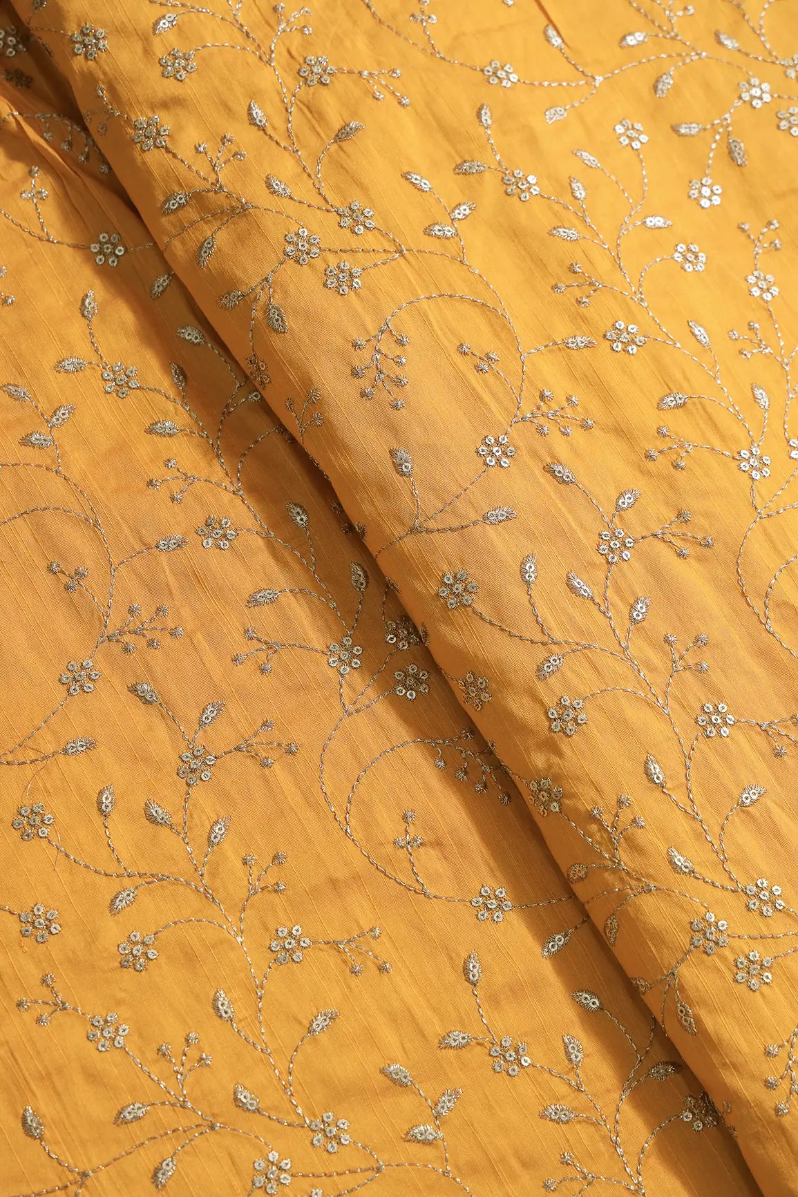 Gold Sequins With Gold Zari Floral Leafy Embroidery Work On Yellow Raw Silk Fabric