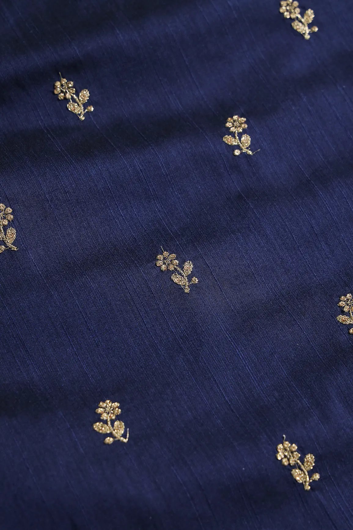 Gold Sequins With Gold Zari Small Floral Motif Embroidery Work On Navy Blue Raw Silk Fabric