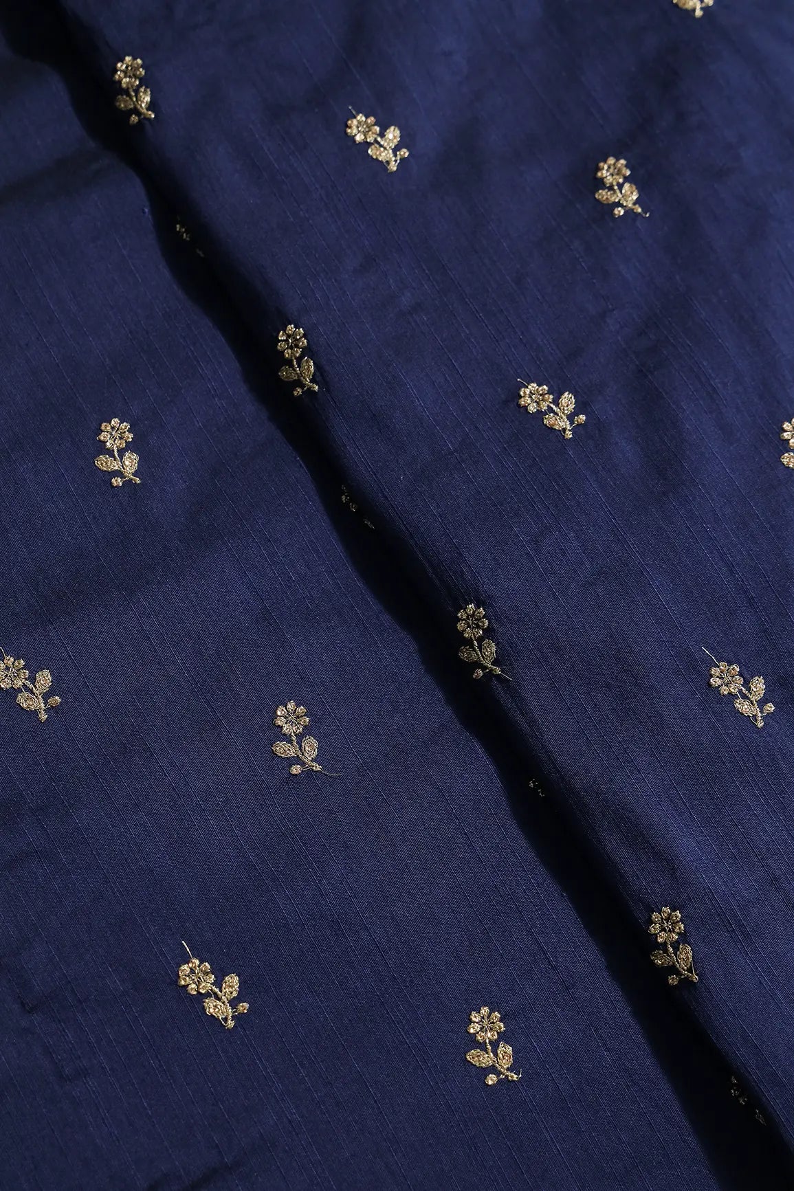 Gold Sequins With Gold Zari Small Floral Motif Embroidery Work On Navy Blue Raw Silk Fabric
