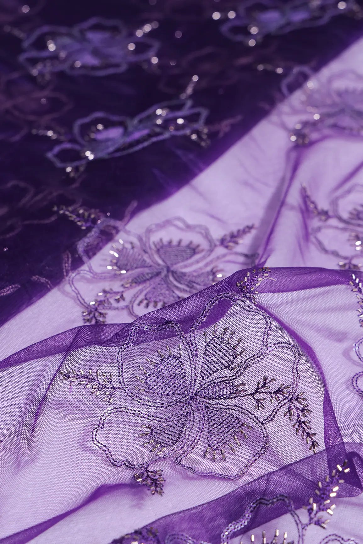 Purple Thread & Gold Beads With Water Sequins Floral Embroidery On Purple Soft Net Fabric
