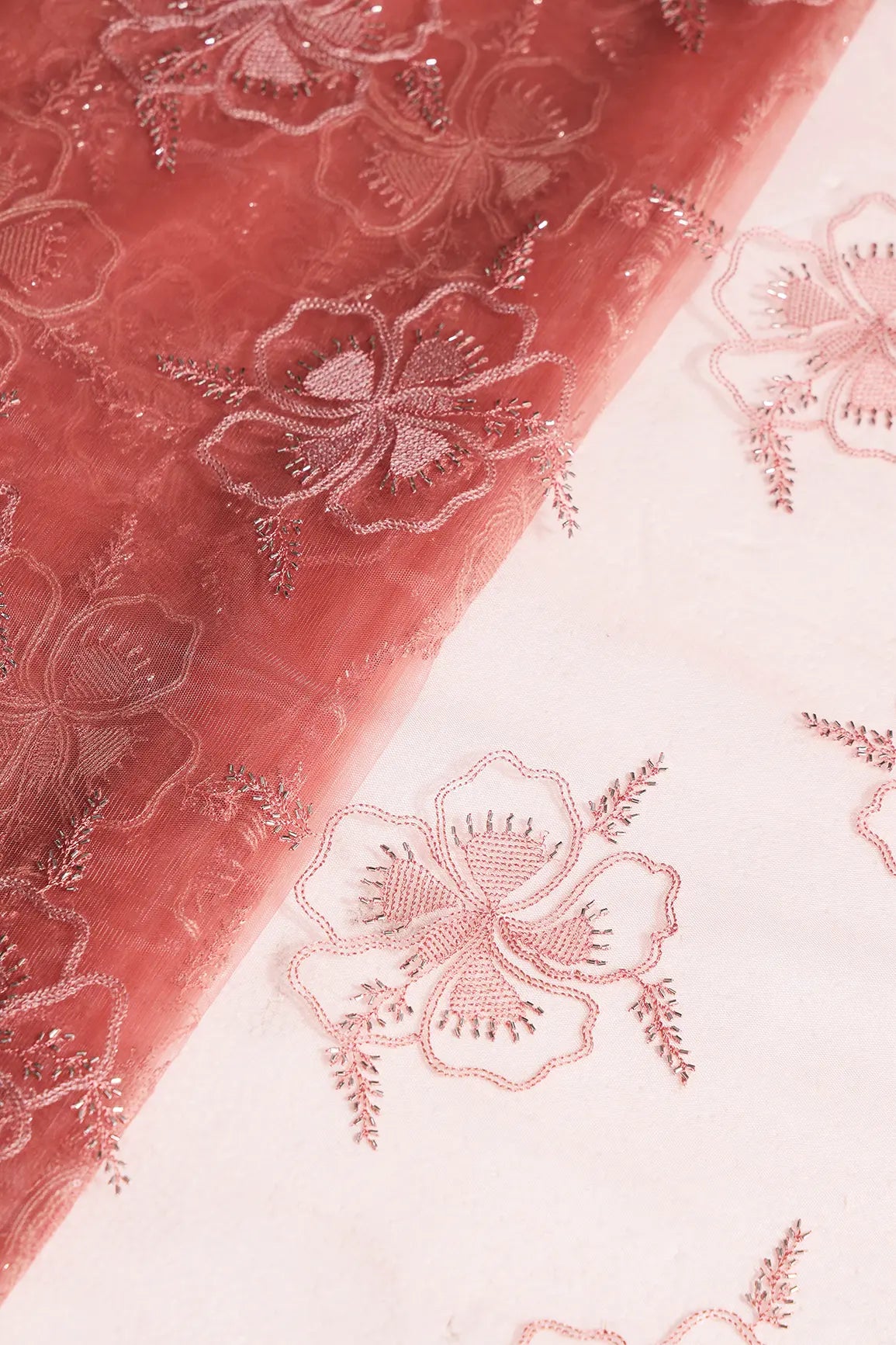 Gajri Pink Thread & Gold Beads With Water Sequins Floral Embroidery On Gajri Pink Soft Net Fabric