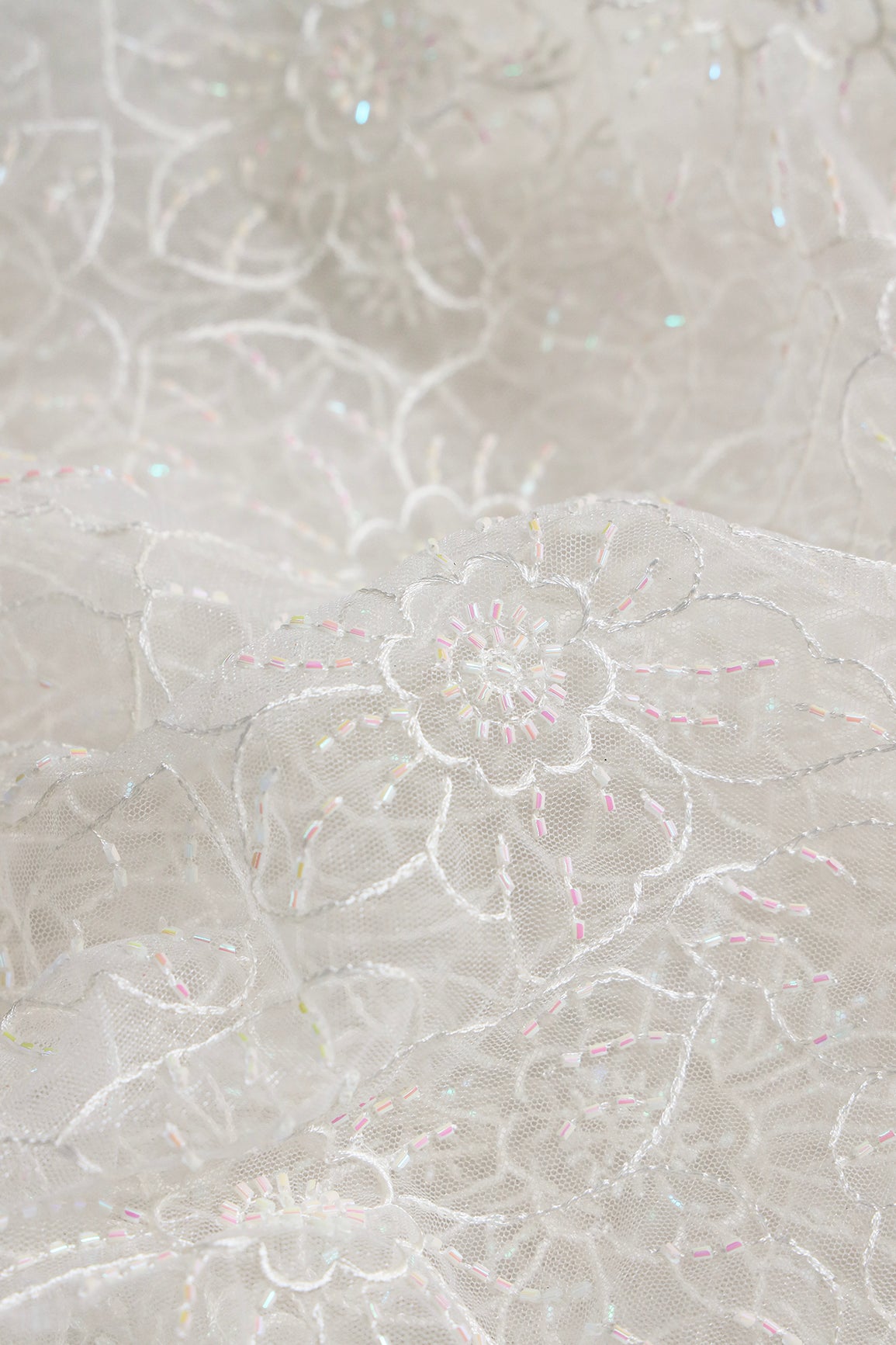 White Thread With Beads Floral Embroidery Work On White Dyeable Soft Net Fabric