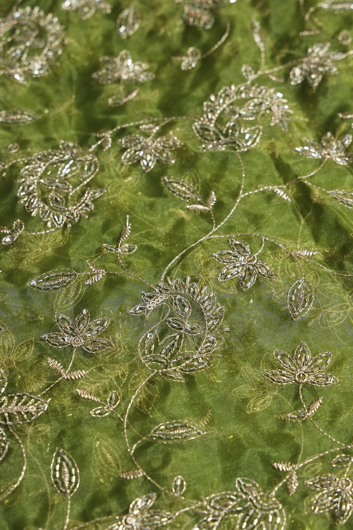 Gold Sequins & Beads With Zari Floral Leafy Paisley Embroidery Work On Green Organza Fabric