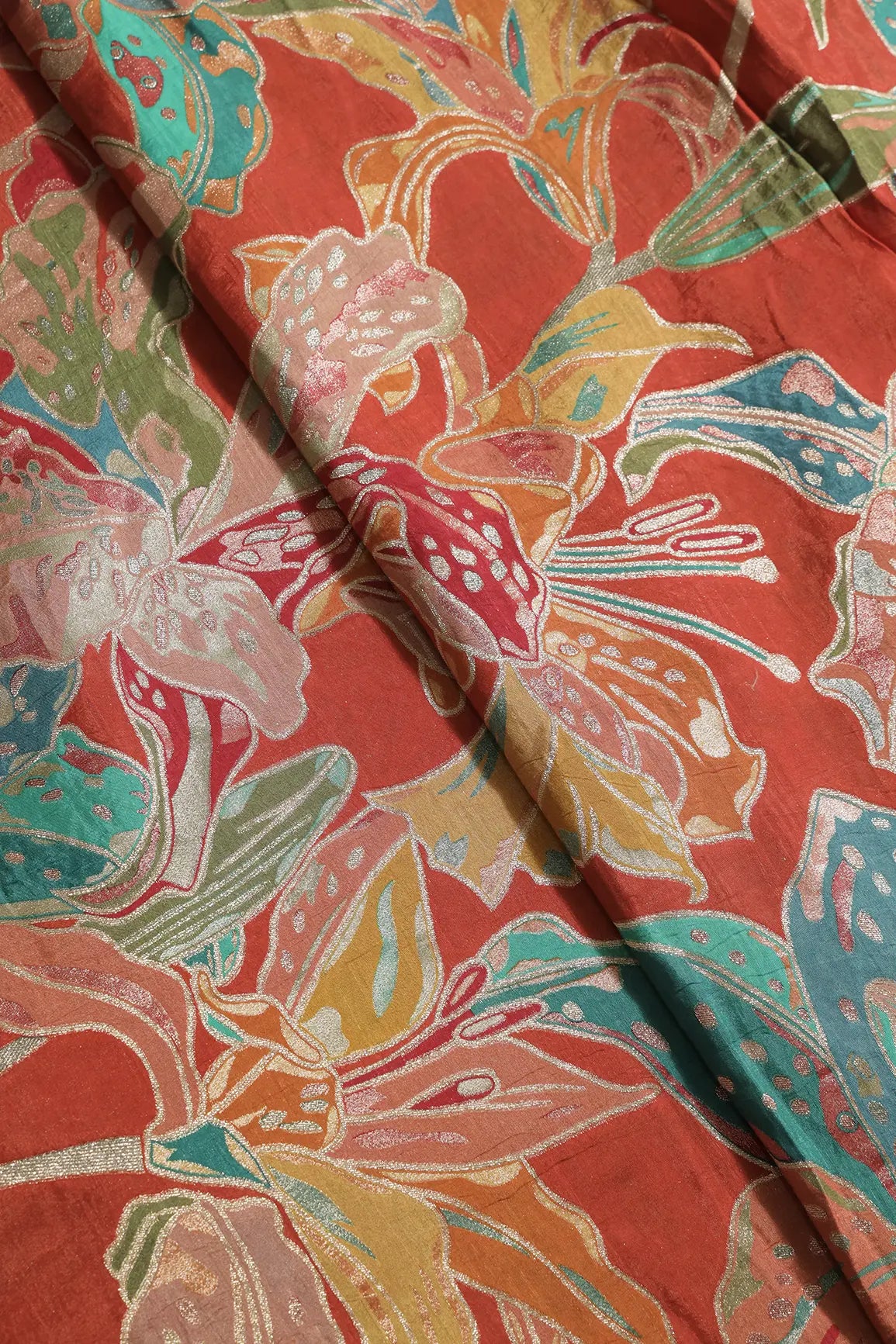 Positional Floral Zari Print On Rust Orange Viscose Dola Silk Jacquard Fabric