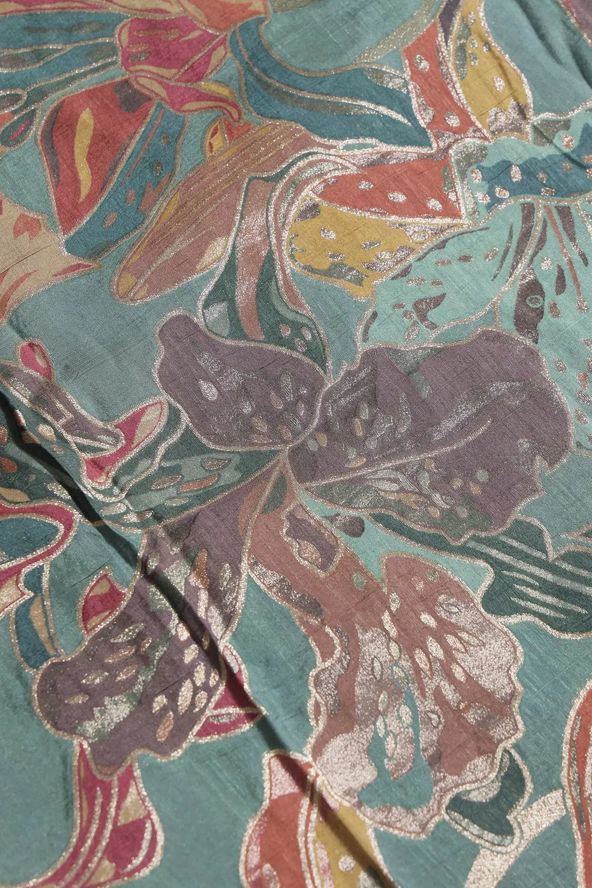 Positional Floral Zari Print On Teal Viscose Dola Silk Jacquard Fabric