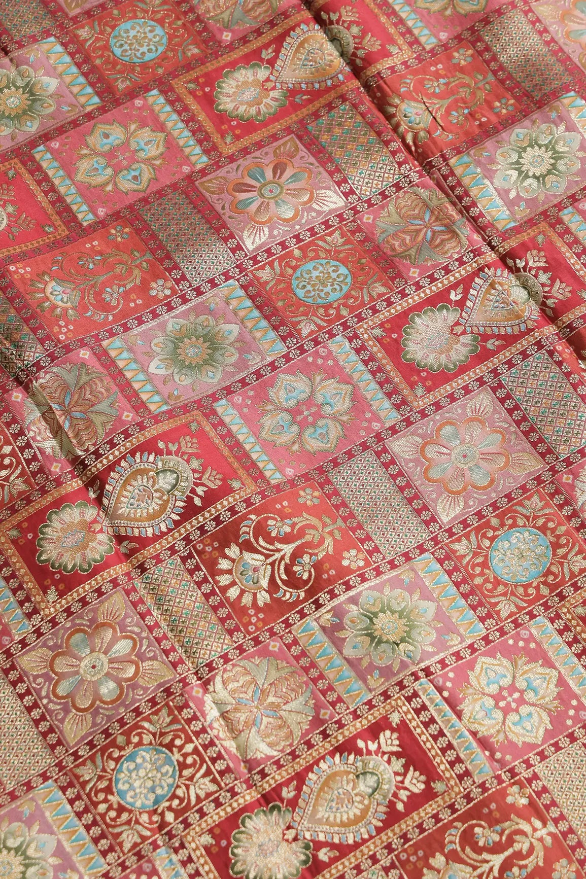 Positional Floral Zari Print On Red Viscose Dola Silk Jacquard Fabric
