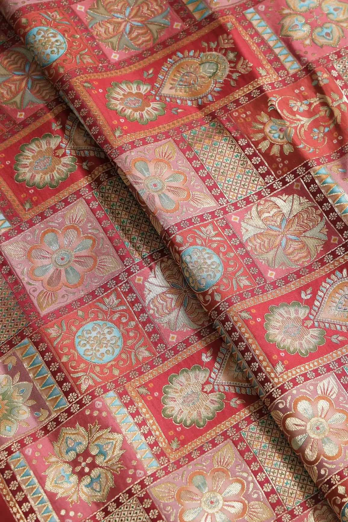 Positional Floral Zari Print On Red Viscose Dola Silk Jacquard Fabric