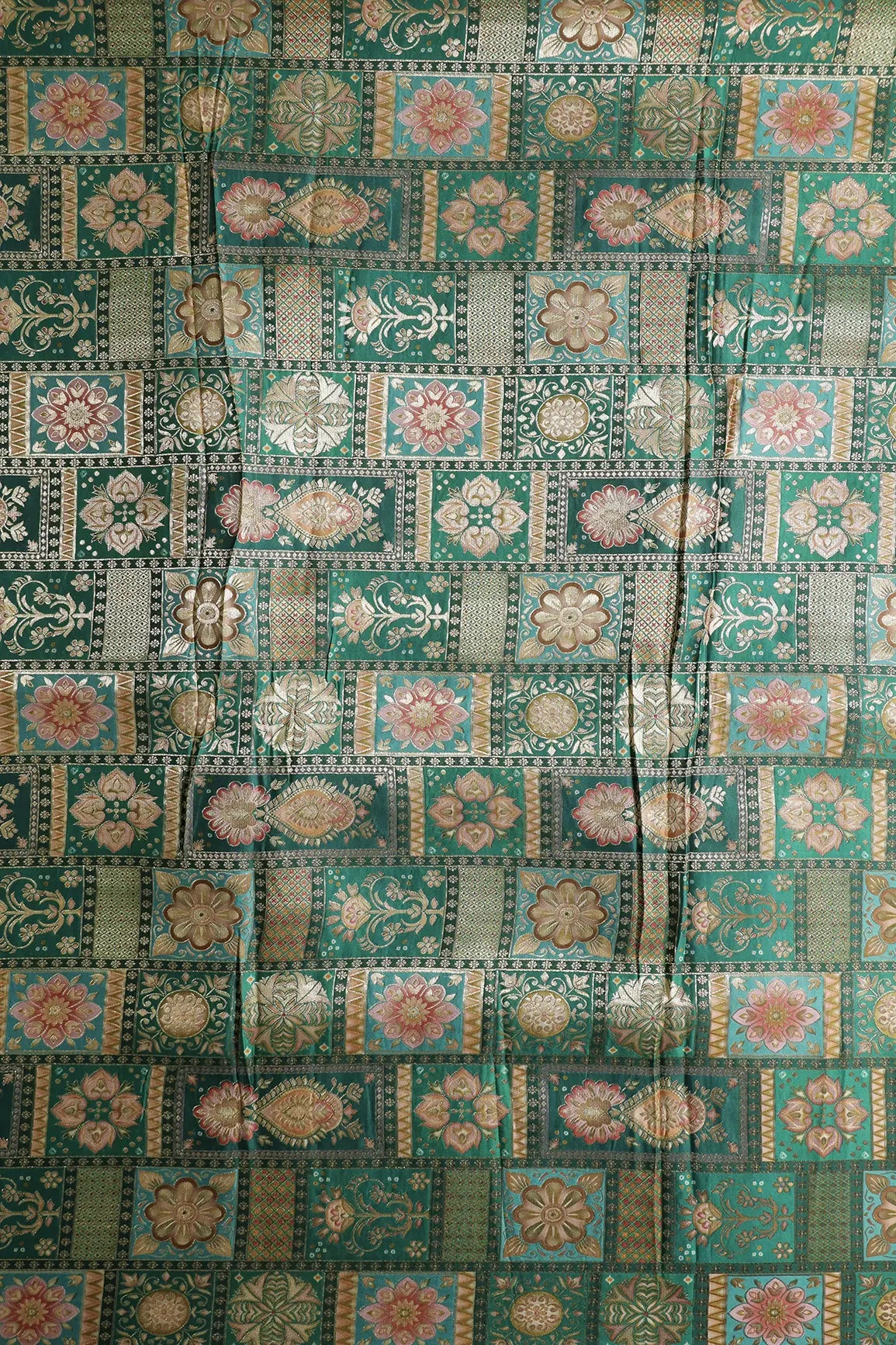 Positional Floral Zari Print On Green Viscose Dola Silk Jacquard Fabric