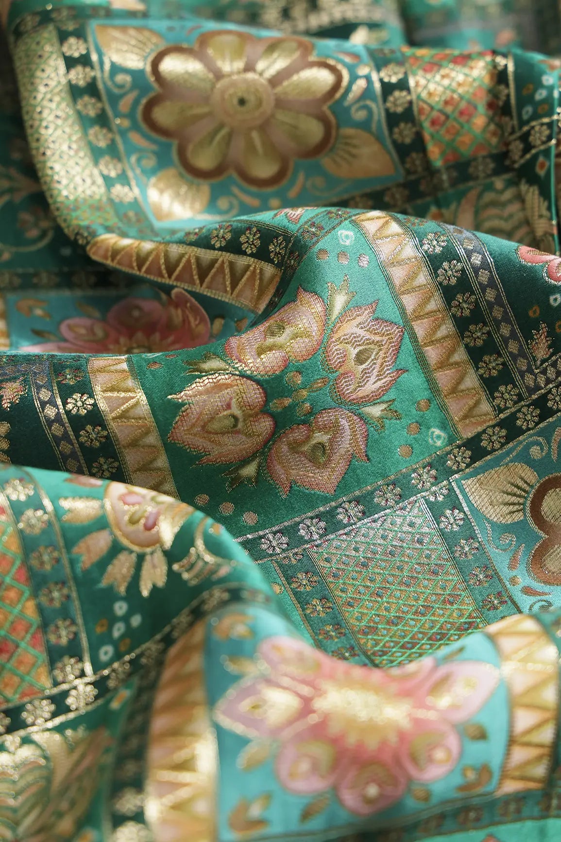 Positional Floral Zari Print On Green Viscose Dola Silk Jacquard Fabric