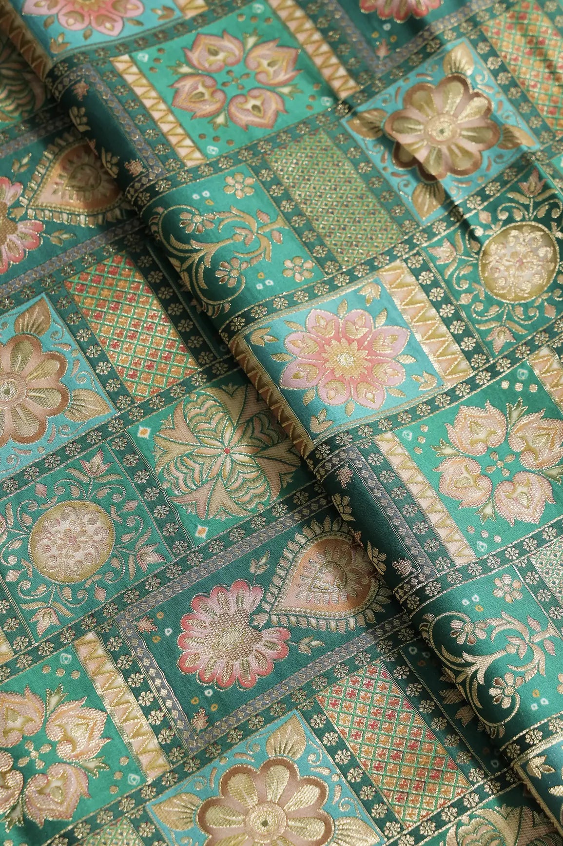 Positional Floral Zari Print On Green Viscose Dola Silk Jacquard Fabric