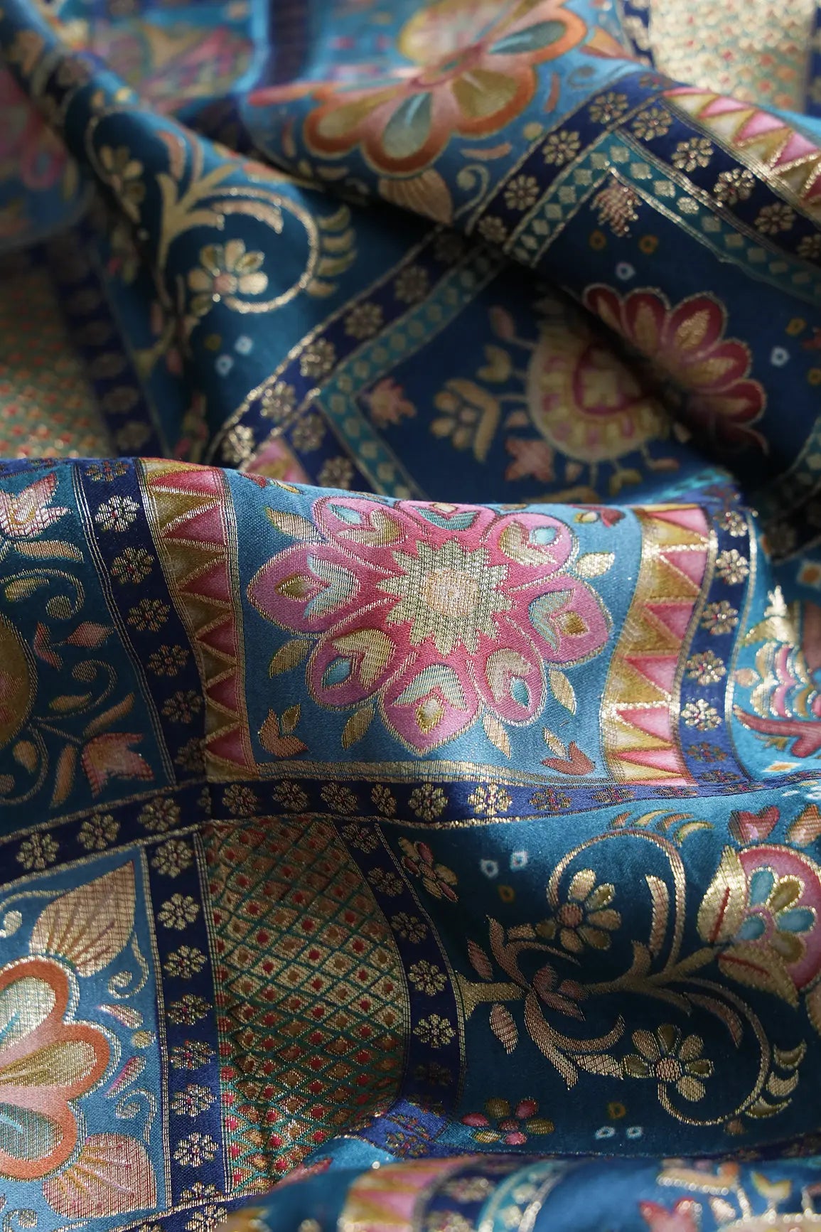 Positional Floral Zari Print On Rama Blue Viscose Dola Silk Jacquard Fabric