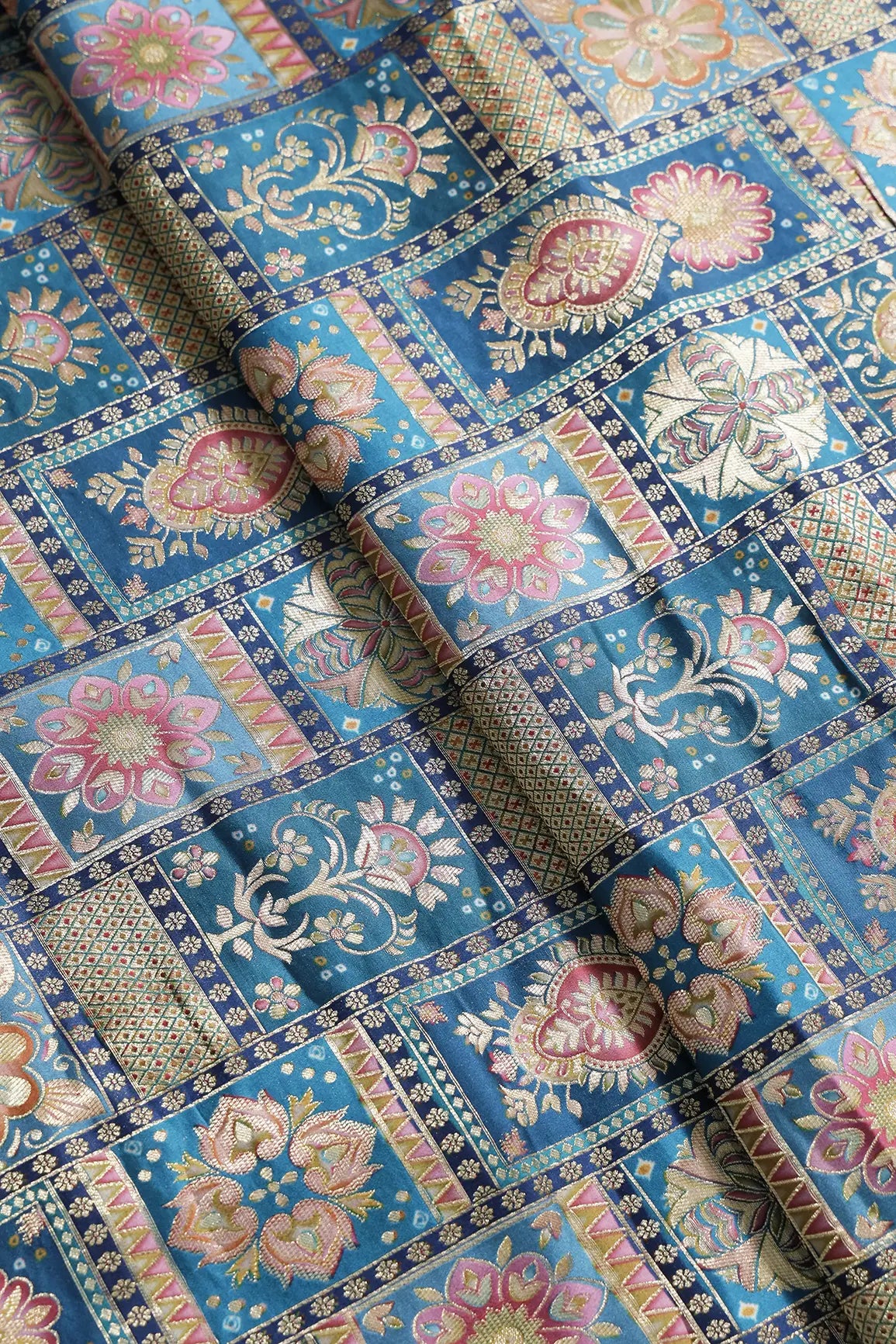 Positional Floral Zari Print On Rama Blue Viscose Dola Silk Jacquard Fabric