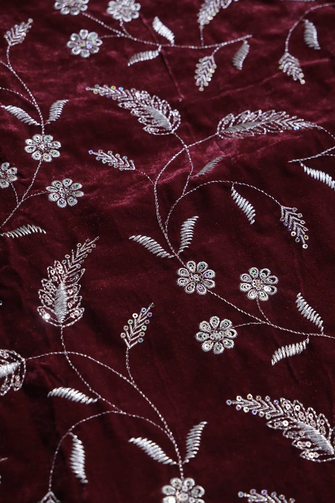 Gold Sequins With Gold Zari Floral Leafy Embroidery Work On Maroon Velvet Fabric
