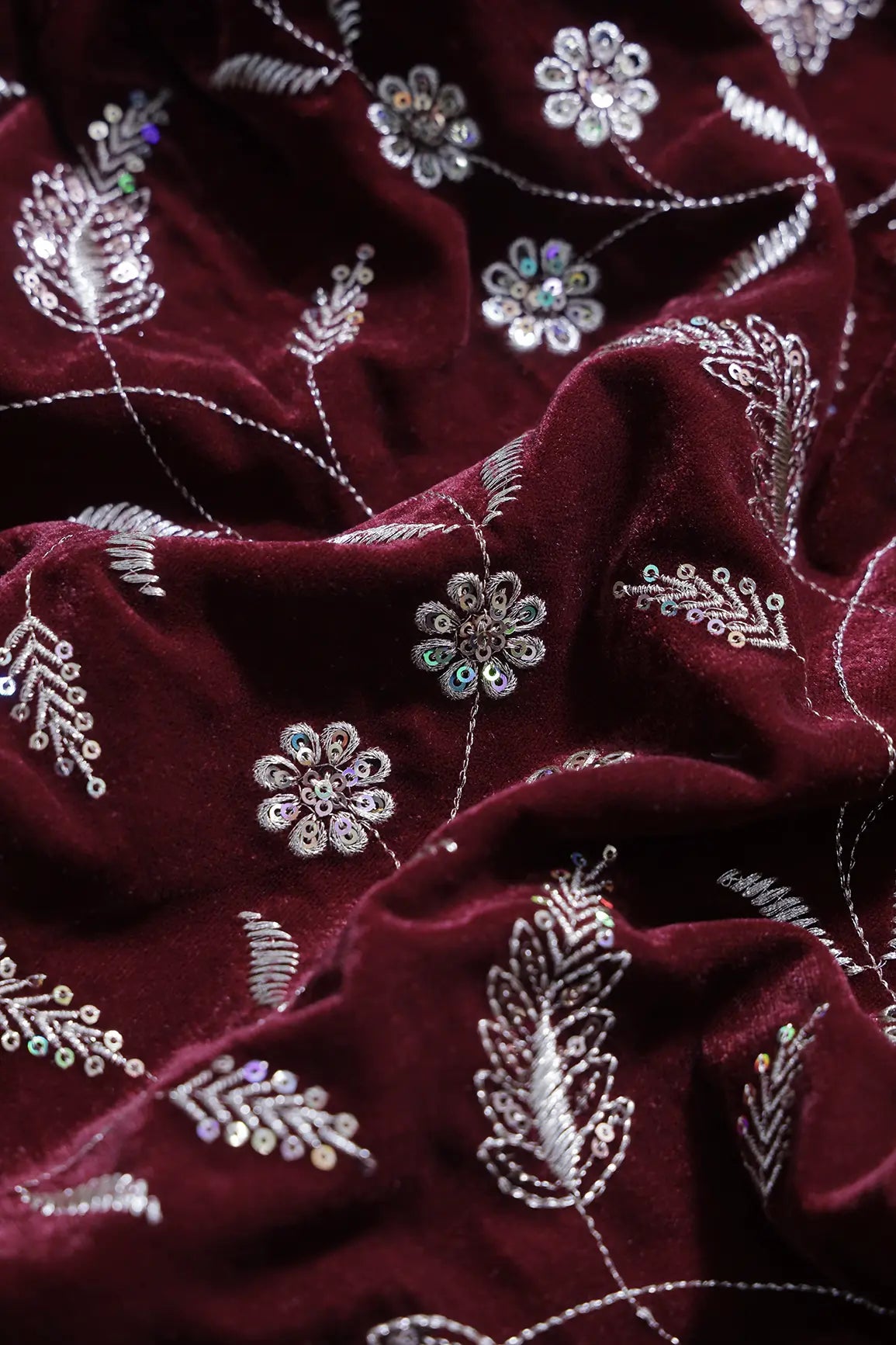 Gold Sequins With Gold Zari Floral Leafy Embroidery Work On Maroon Velvet Fabric