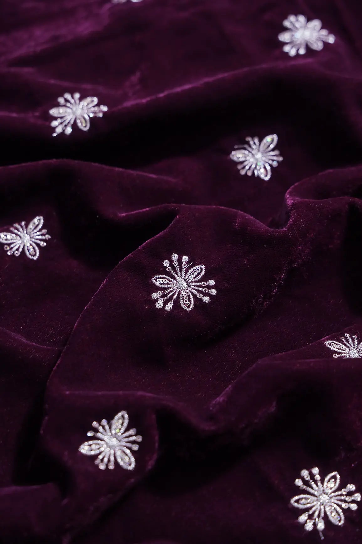 Gold Sequins With Gold Zari Small Floral Motif Embroidery Work On Wine Velvet Fabric