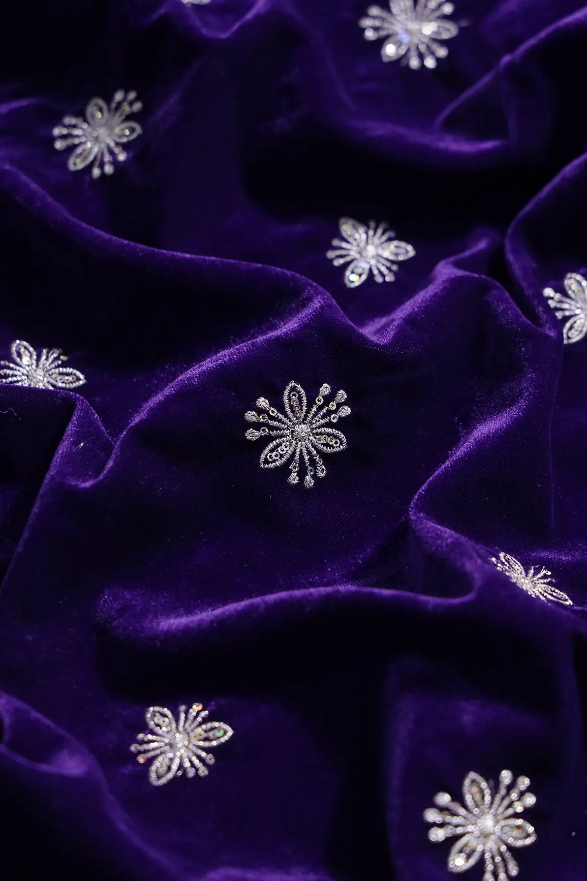 Gold Sequins With Gold Zari Small Floral Motif Embroidery Work On Purple Velvet Fabric