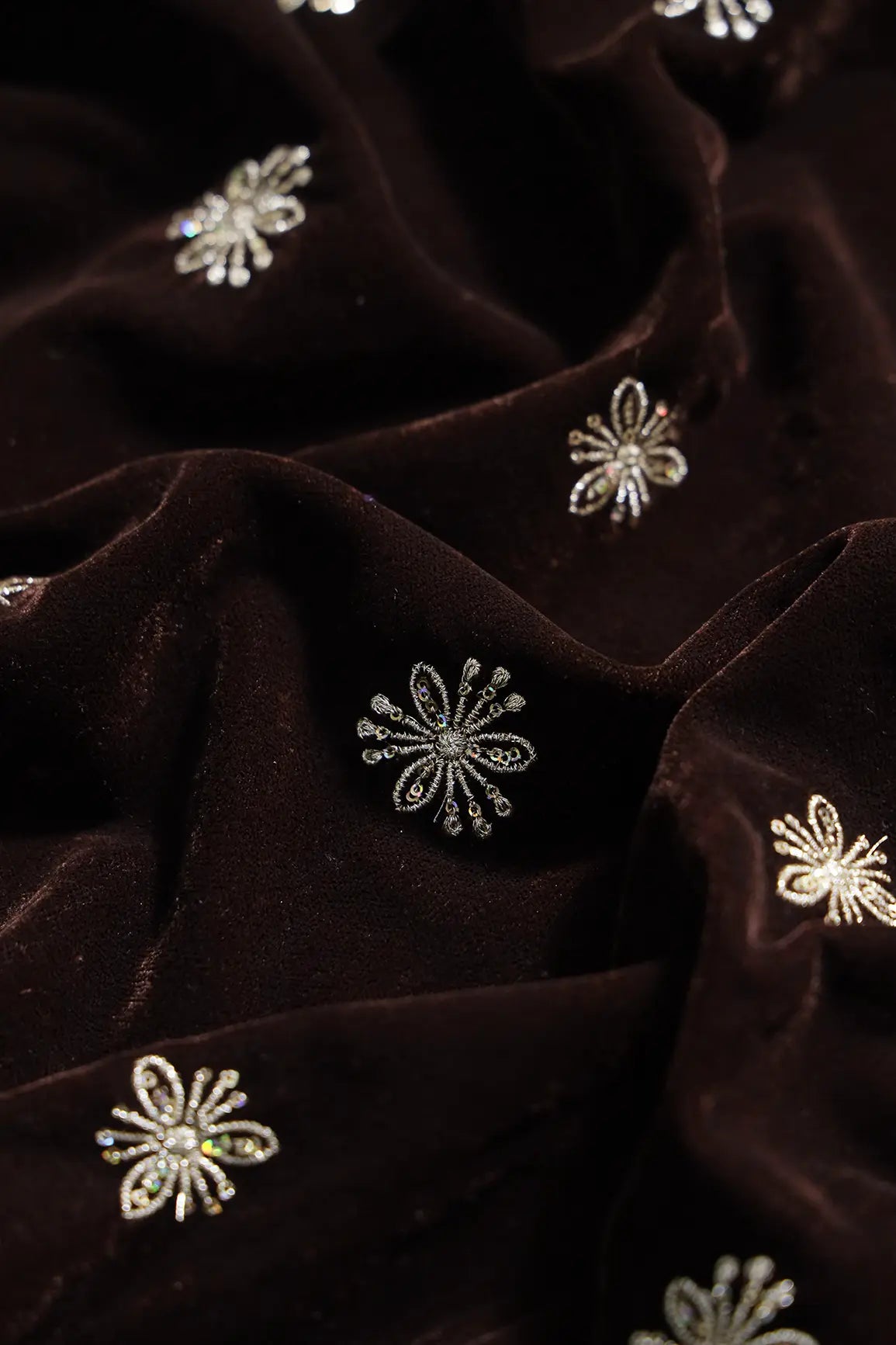 Gold Sequins With Gold Zari Small Floral Motif Embroidery Work On Coffee Velvet Fabric