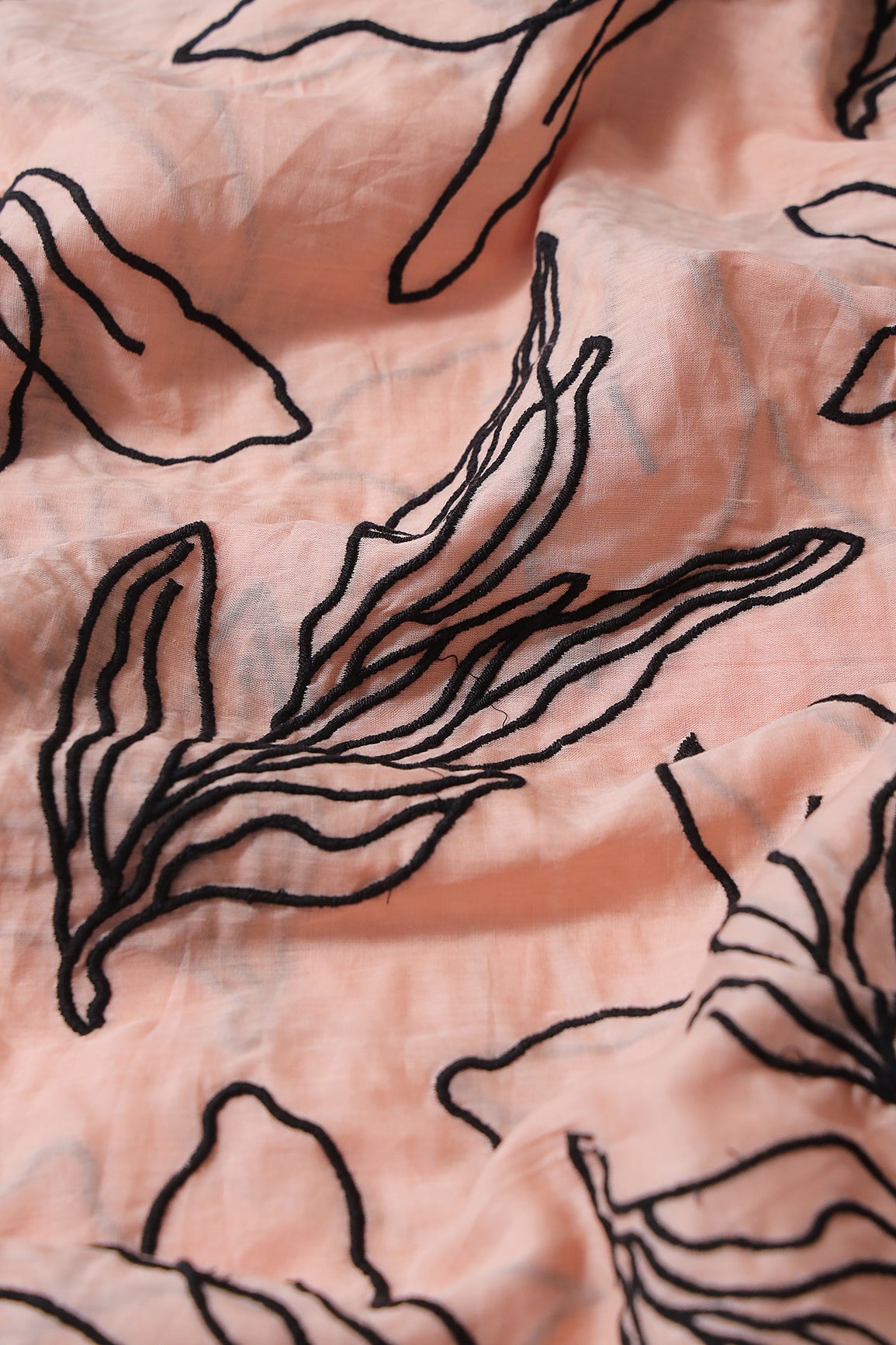 Beautiful Black Floral Embroidery On Peach Pure Mul Cotton Fabric