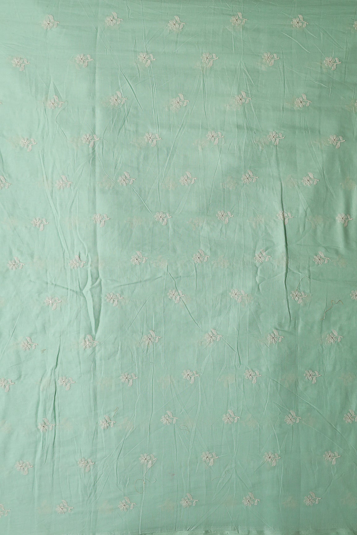 White Thread Small Floral Embroidery On Sea Green Pure Mul Cotton Fabric
