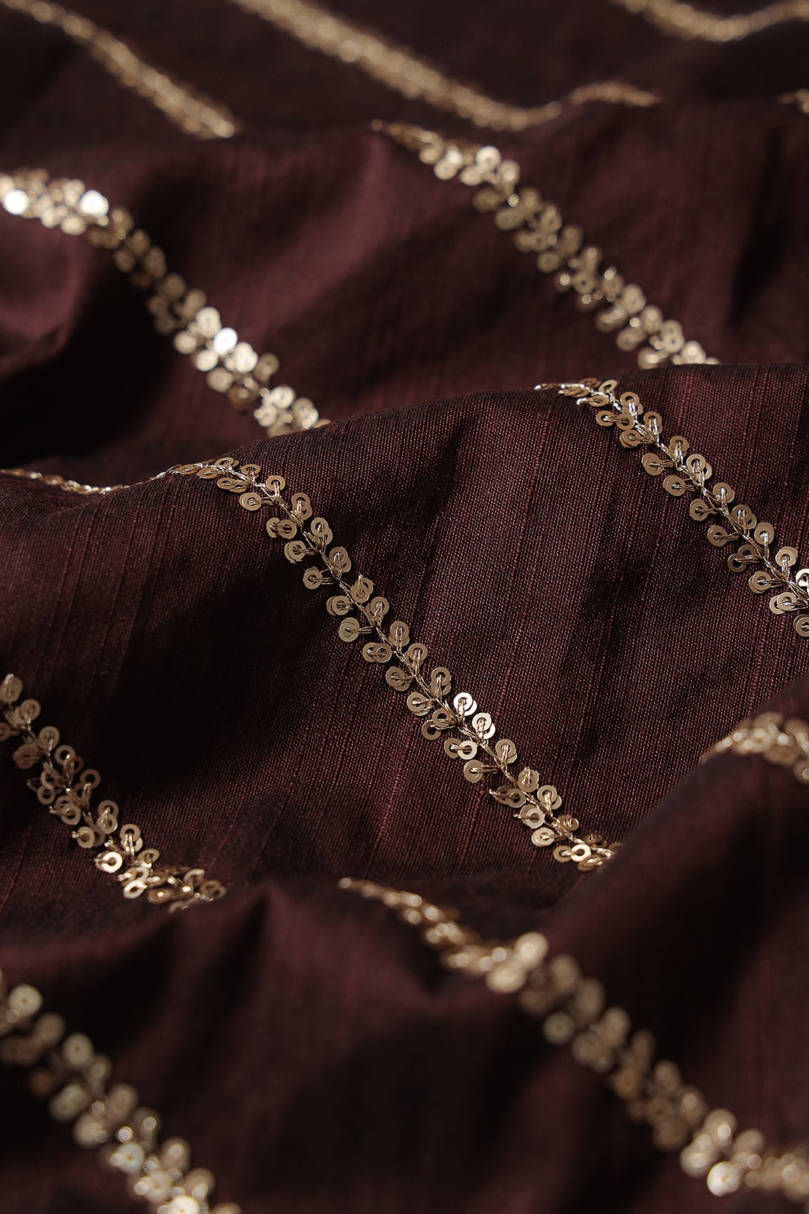 Gold Sequins With Gold Zari Stripes Embroidery Work On Brown Raw Silk Fabric