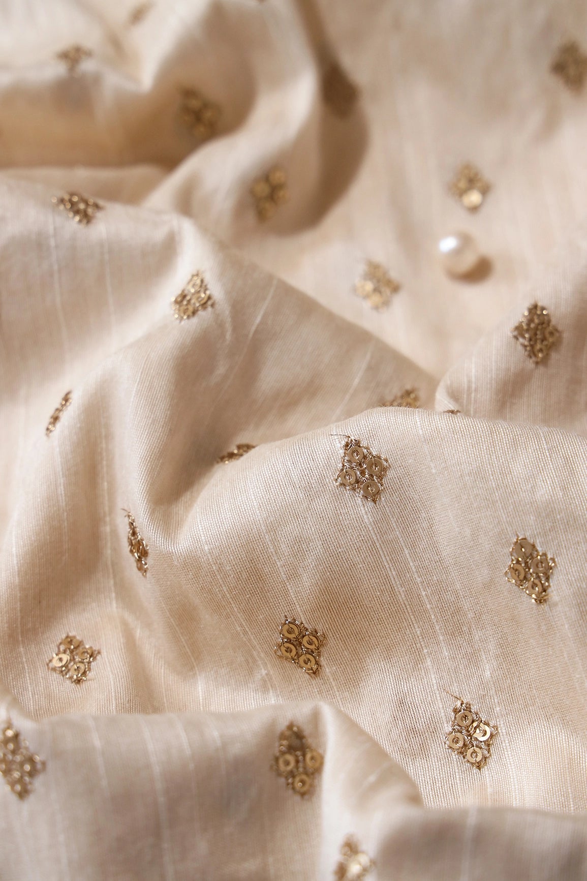 Gold Sequins With Gold Zari Small Motif Embroidery Work On Cream Raw Silk Fabric