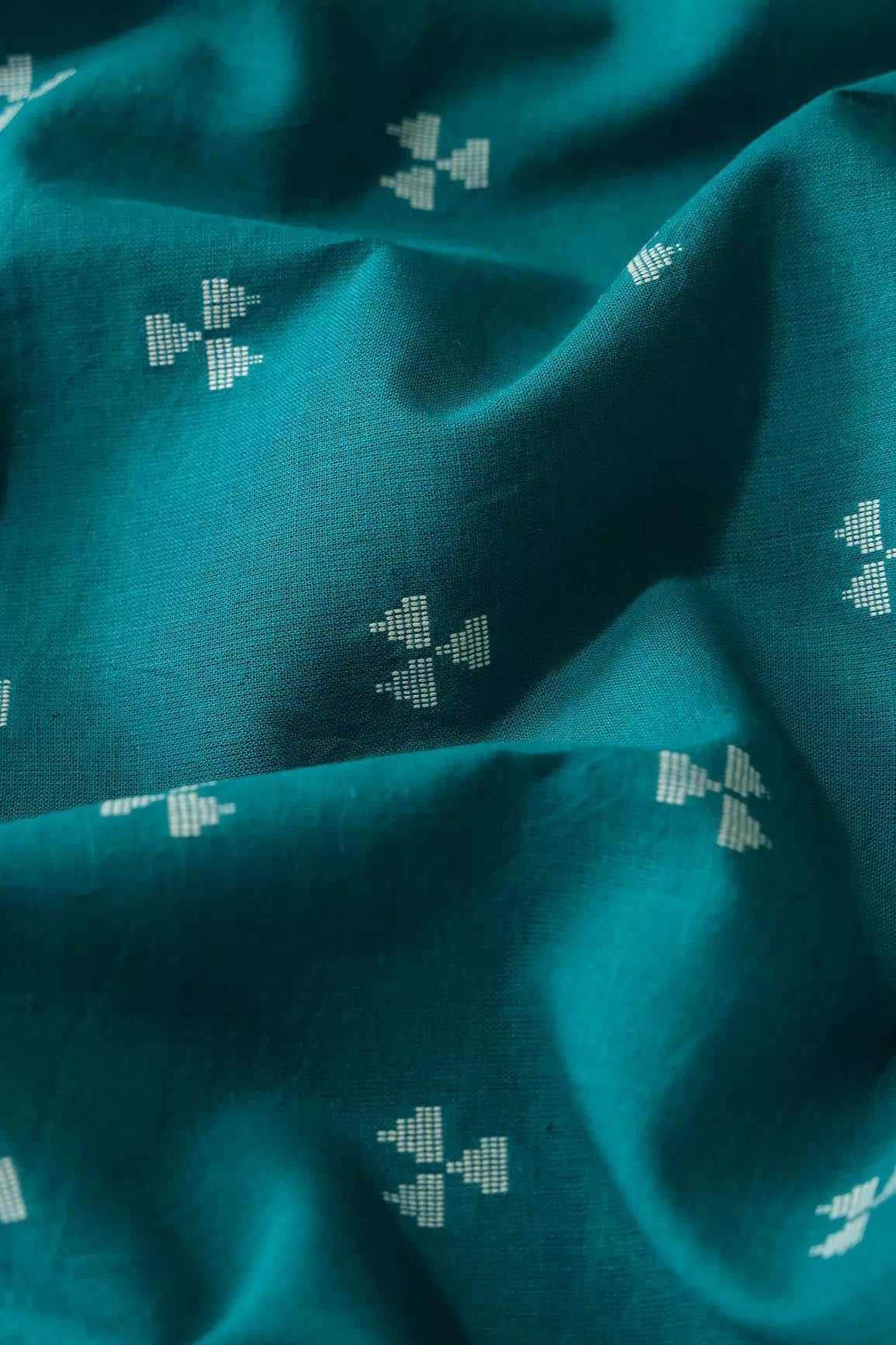 White And Dark Turquoise Geometric Pattern On Handwoven Organic Cotton Fabric