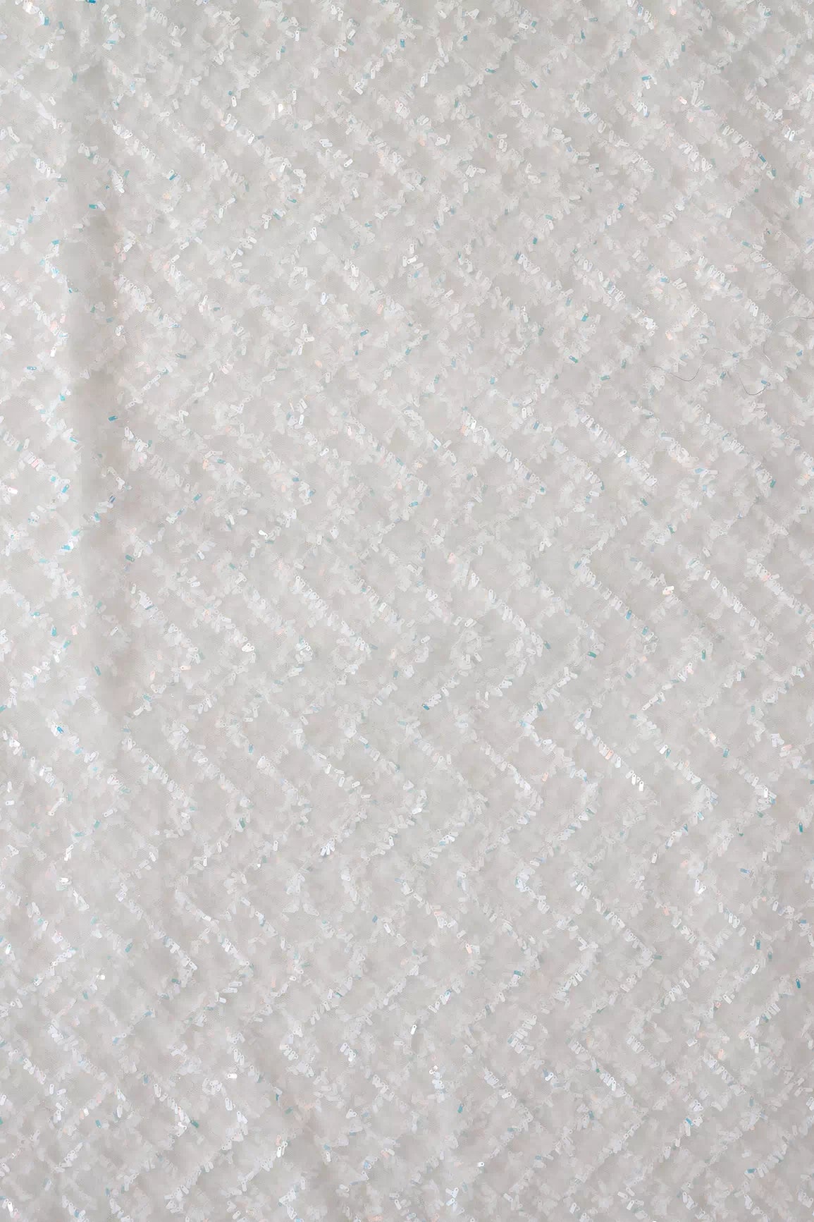 Oval Sequins Chevron Embroidery Work On White Dyeable Soft Net Fabric
