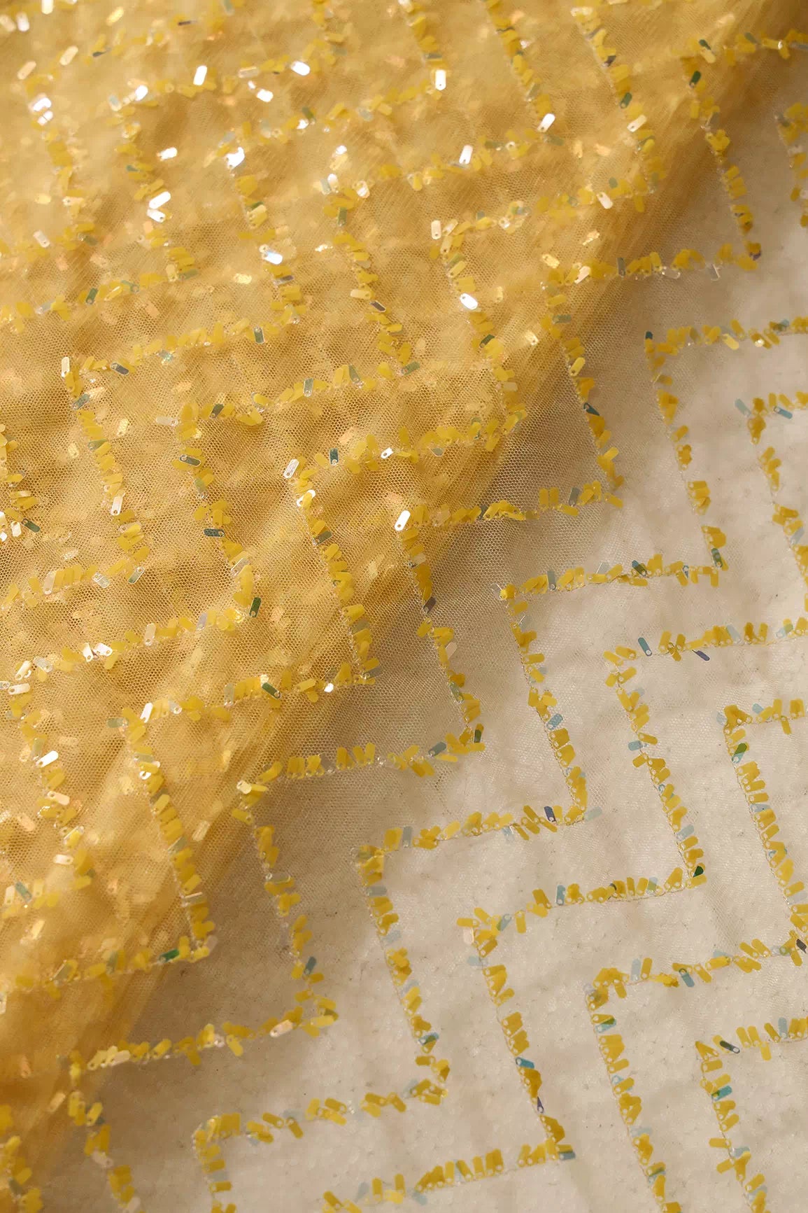 Oval Sequins Chevron Embroidery Work On Yellow Soft Net Fabric