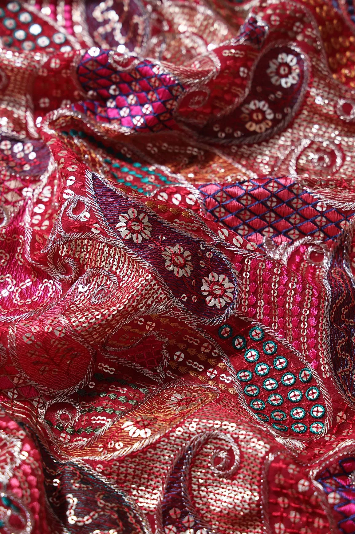 Gorgeous Multi Thread With Gold Sequins Paisley Heavy Embroidery On Red Georgette Fabric