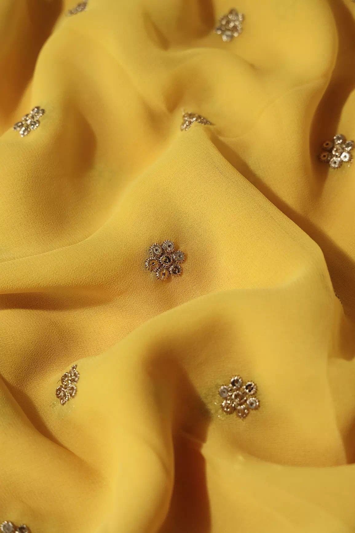 Gold Sequins With Gold Zari Small Motif Embroidery Work On Yellow Viscose Georgette Fabric