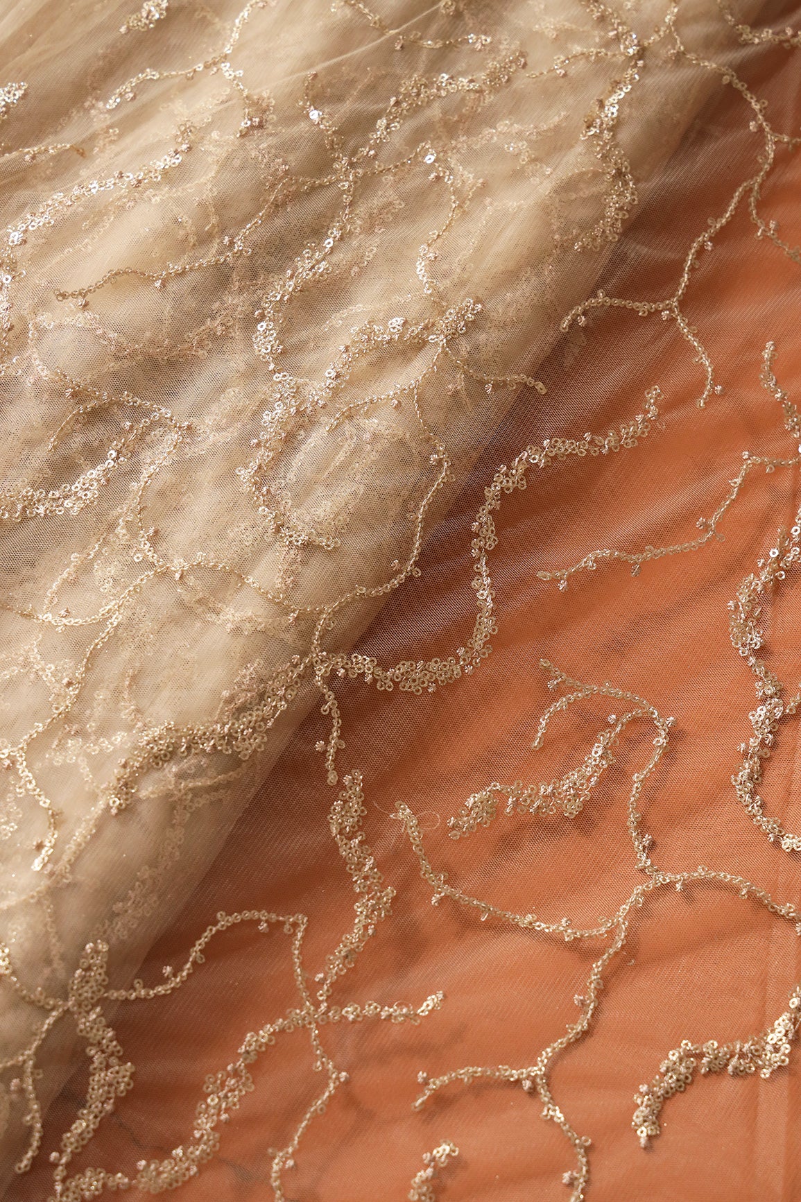 Beige Thread With Gold Glitter Sequins Abstract Embroidery On Beige Soft Net Fabric