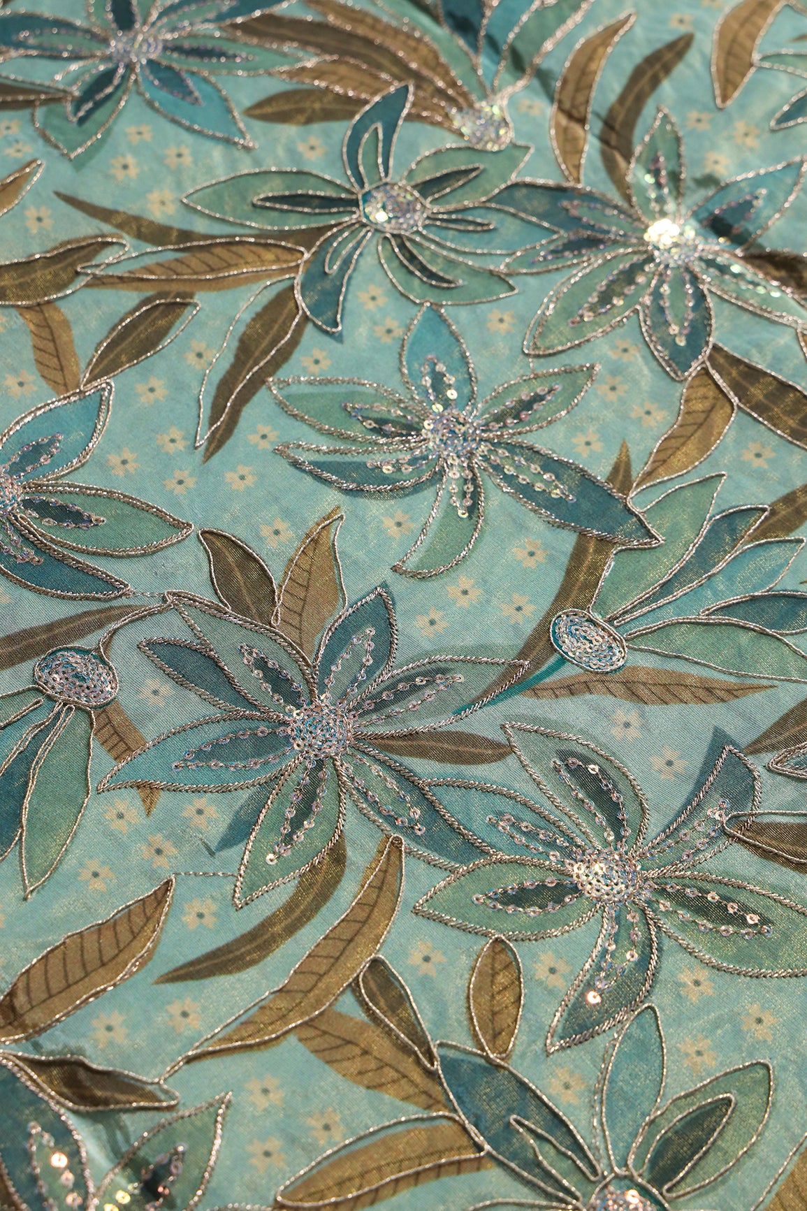 Floral Position Print On Sequins With Zari Embroidery On Pastel Olive Viscose Zari Tissue Fabric