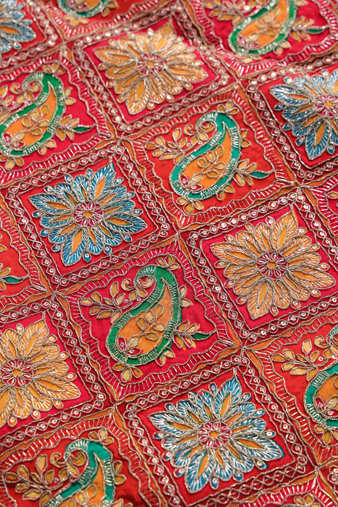 Positional Print With Sequins And Traditional Embroidery On Red And Rani Crepe Fabric