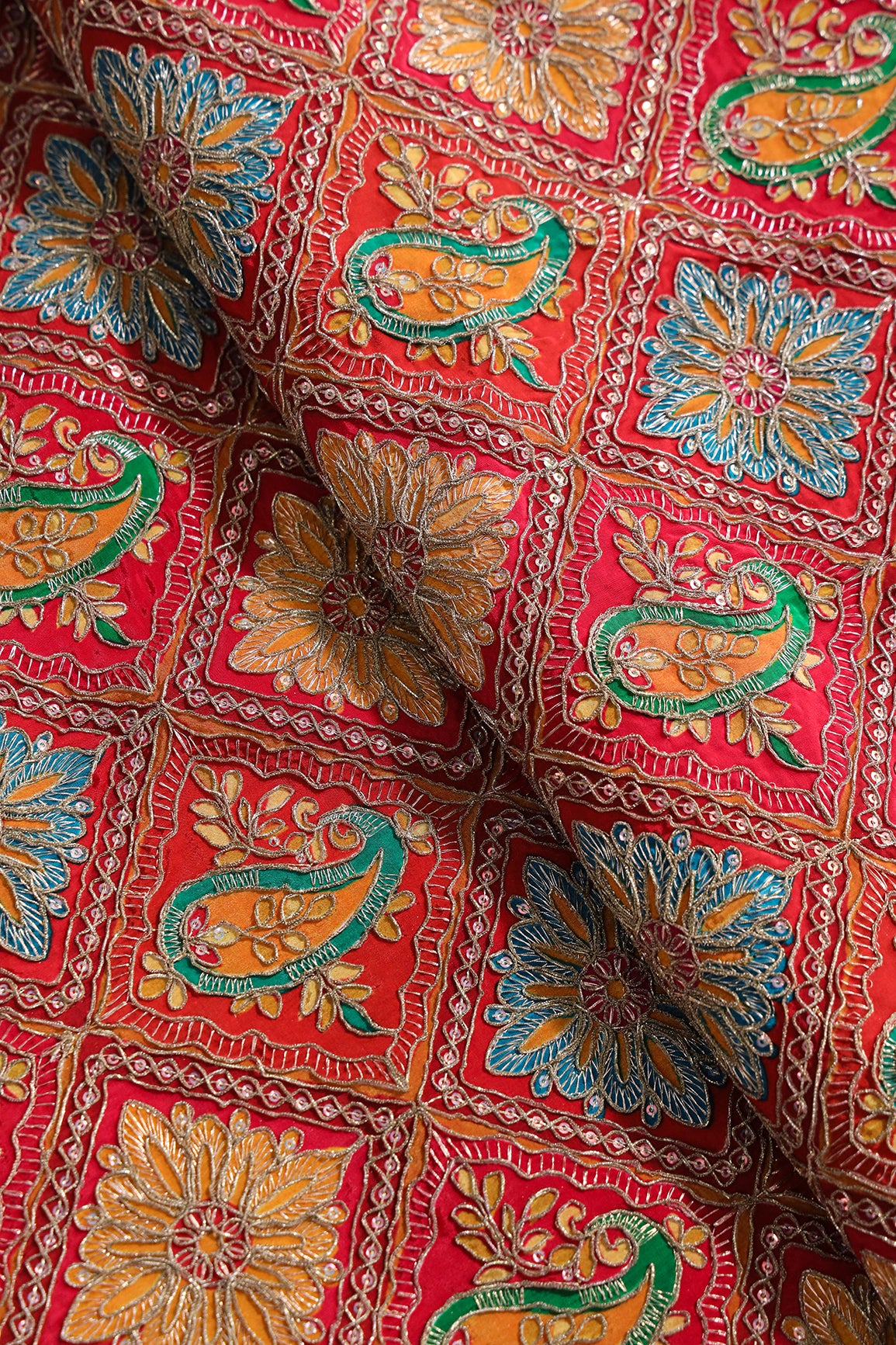 Positional Print With Sequins And Traditional Embroidery On Red And Rani Crepe Fabric